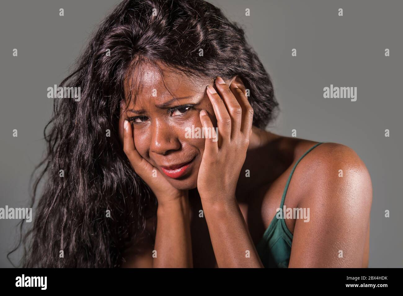 young attractive sad and depressed black African American woman feeling