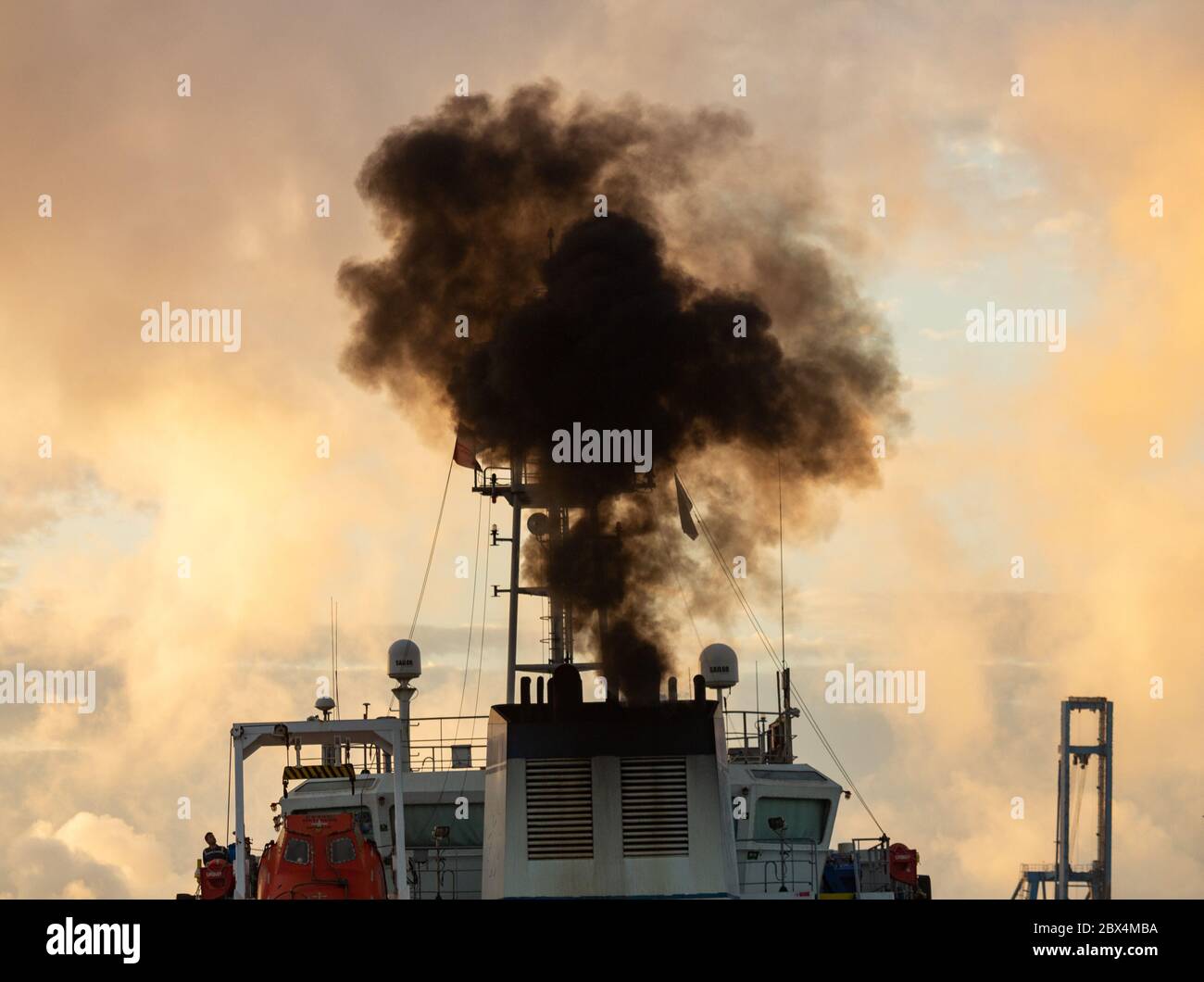 Las Palmas, Gran Canaria, Canary Islands, Spain. 5th June, 2020.  A fuel tanker belches out black smoke as it arrives in Las Palmas port on Gran Canaria at sunrise. Credit: Alan Dawson/Alamy Live News Stock Photo