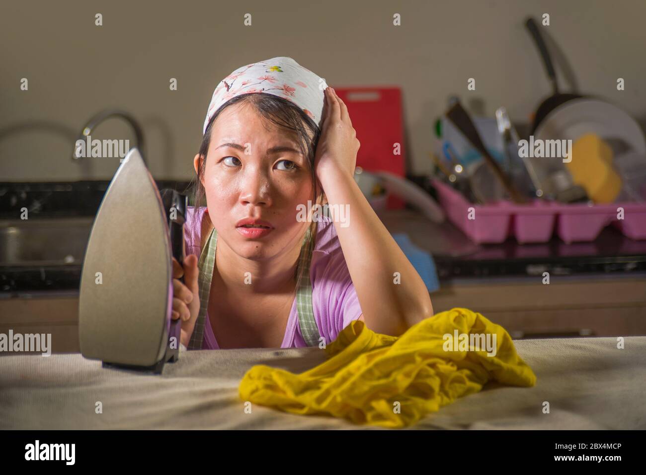 Ironing clothes sad hires stock photography and images Alamy