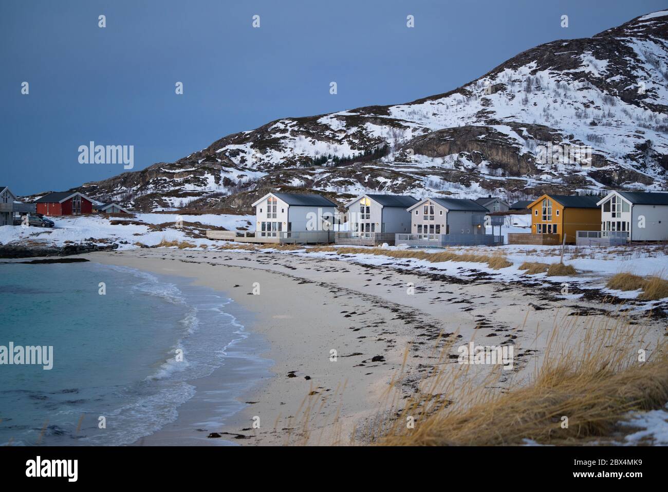 Beach and cabins at Sommarøy close to Tromsø in Norway Stock Photo