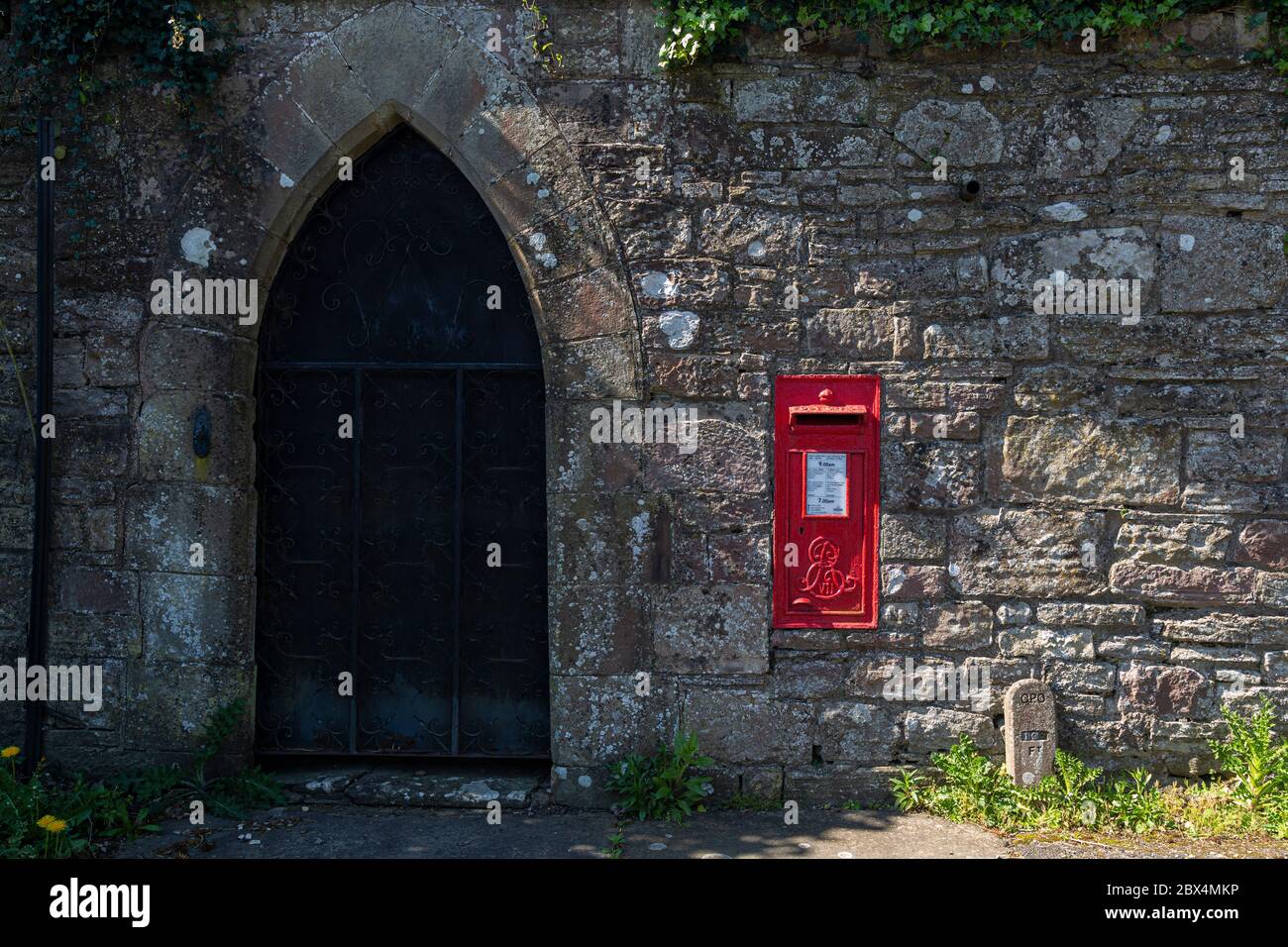 Wall letterbox marked with Edward VII cypher, in an old stone wall, Tintern, Monmouthshire, Wales Stock Photo
