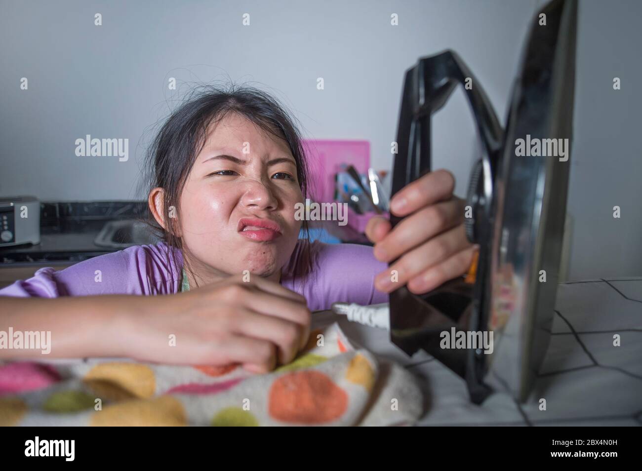 Woman ironing in kitchen hires stock photography and images Alamy