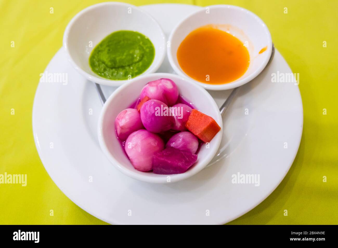 Appetizers, garlic and shalot onions with spicy and sweet sauce, Indian restaurant, Hue, Vietnam Stock Photo