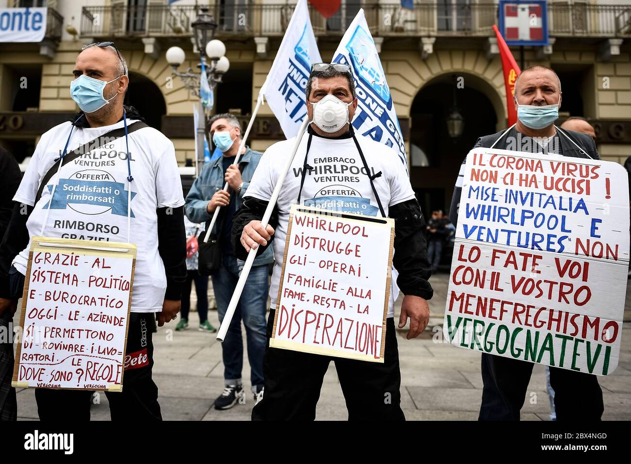 Turin, Italy - 04 June, 2020: Protesters hold placards against Whirlpool and Ventures during a protest by former Embraco workers (Whirlpool group) who complain of unpaid back wages from Ventures. Whirlpool selled Riva di Chieri plant to Ventures on July 2018. Credit: Nicolò Campo/Alamy Live News Stock Photo