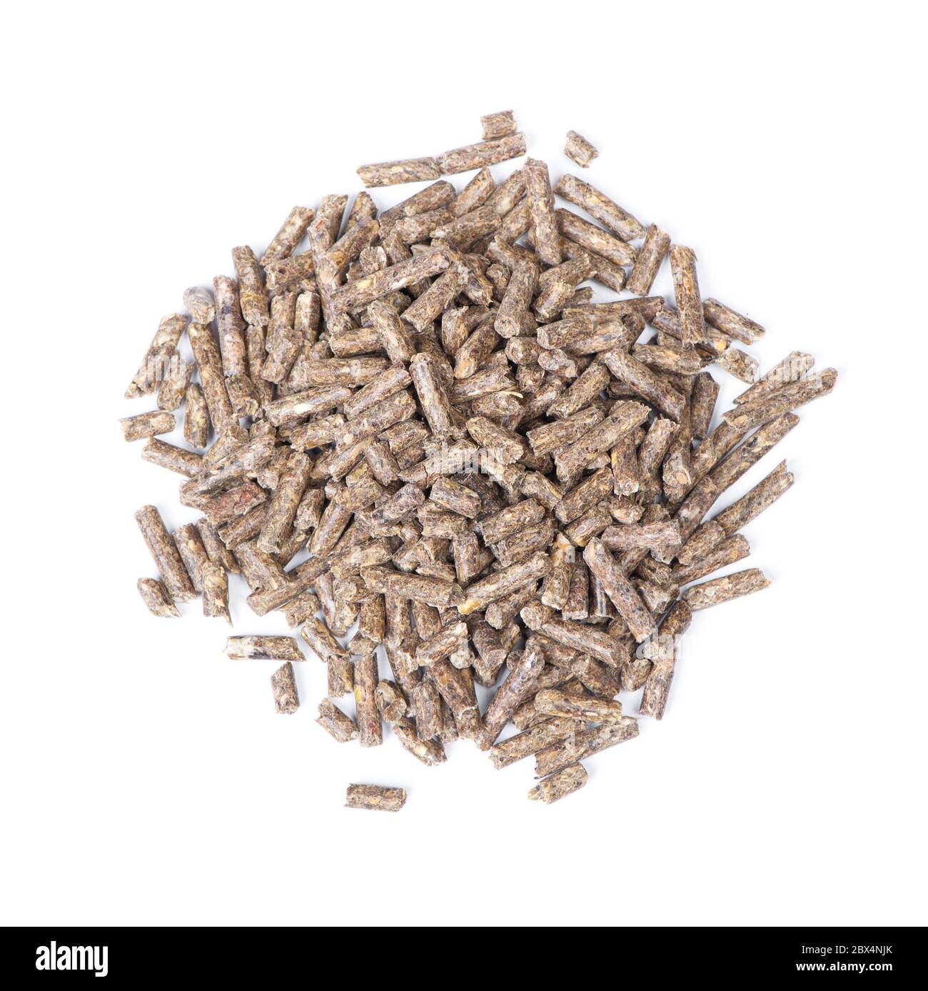 Pile of dry grass pellets for rodents isolated over white background