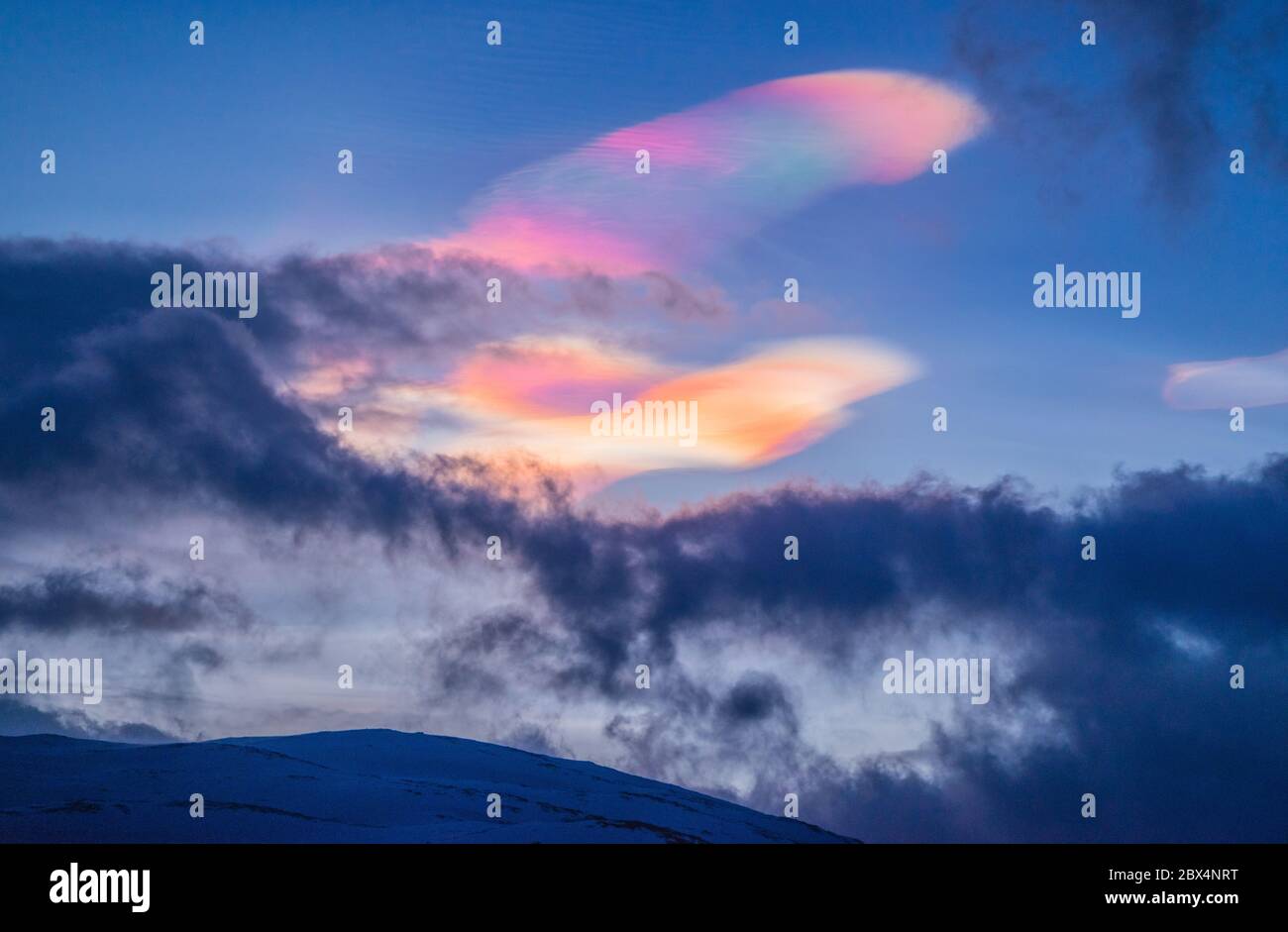 Rainbow clouds in Northern Norway. Clouds iridescence in polar stratospheric. Stock Photo