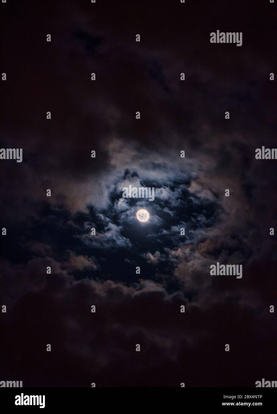 Full moon in the night sky with clouds Stock Photo - Alamy
