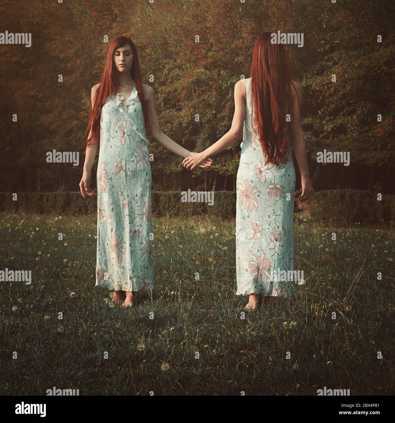 Red hair woman with her mirror soul. Surreal and conceptual Stock Photo