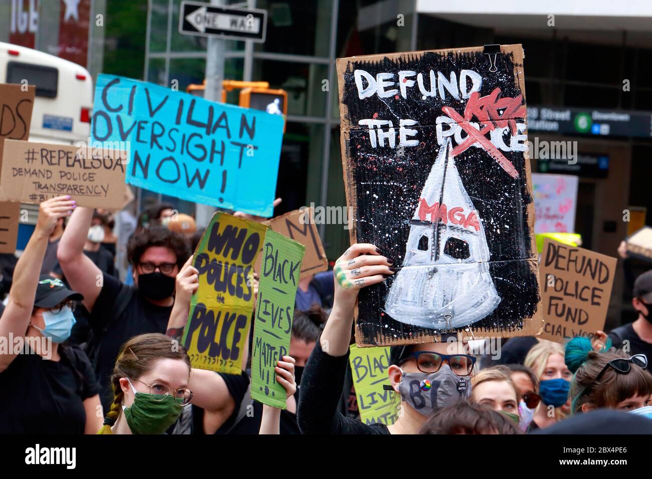 New York, NY. 2nd June 2020. People hold signs 'Defund the Police', 'Civilian Oversight Now!', and 'Repeal 50-a, Demand Police Transparency' at a Black Lives Matter march through Manhattan calling for justice in a recent string of American police killings: George Floyd, Breonna Taylor, and to countless others. Thousands of people joined in the protest march from Foley Square stopping near Gracie Mansion the home of NYC Mayor before moving to Times Square later in the evening. 50-a refers to New York State legislation protecting police personnel and disciplinary records from public scrutiny. Stock Photo