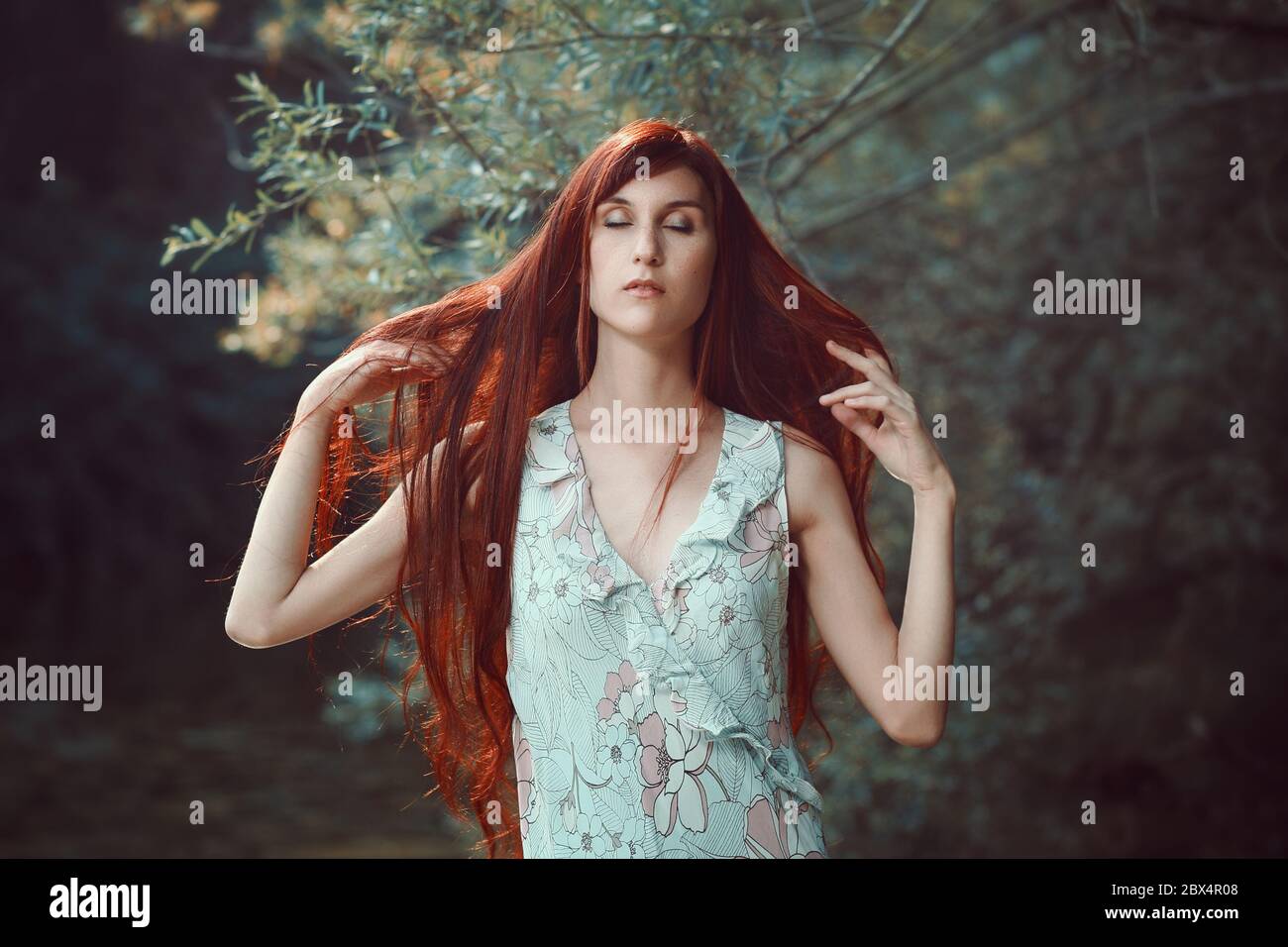 Long red hair woman . Simple outdoor portrait Stock Photo