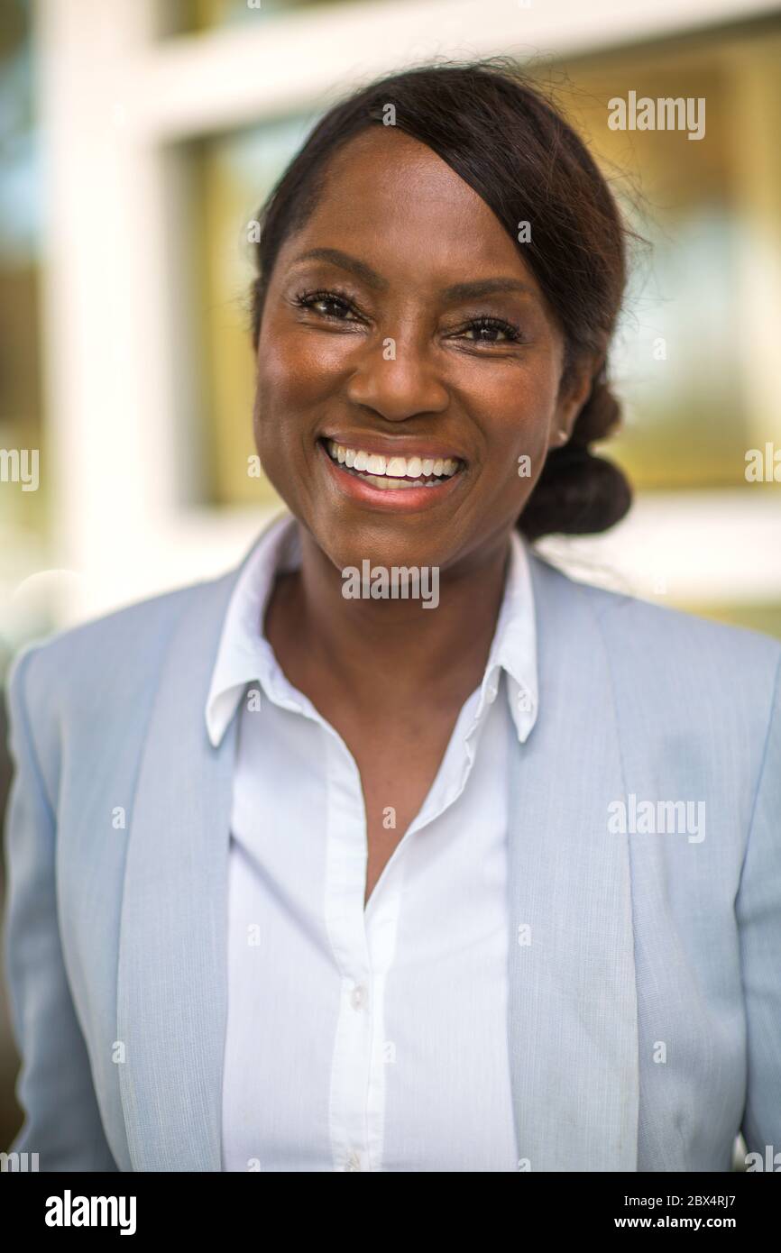 Portrait of a mature healthy older woman happy and smiling. Stock Photo