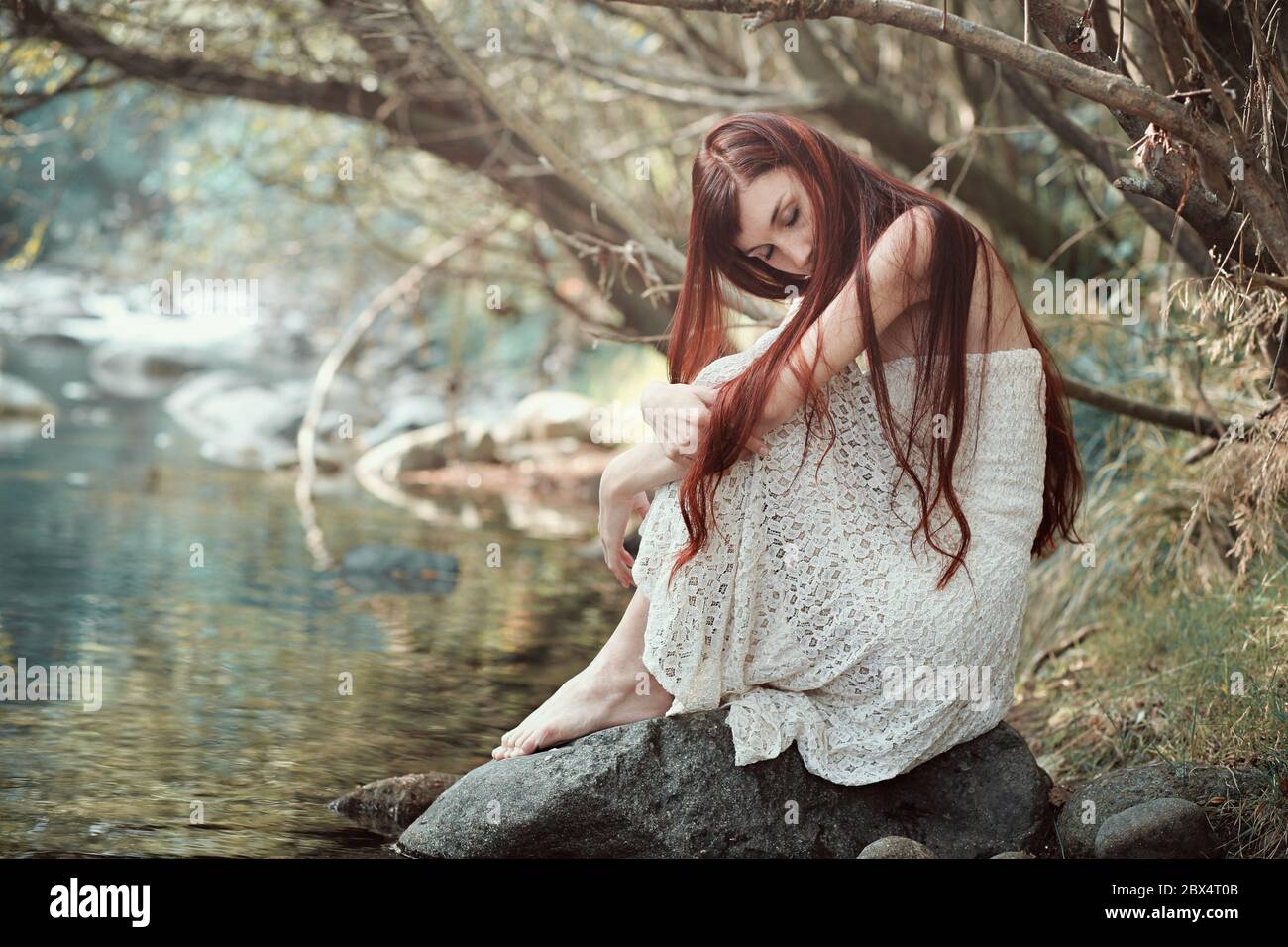 Woman lost in beautiful dreams . Purity and innocence concept Stock Photo
