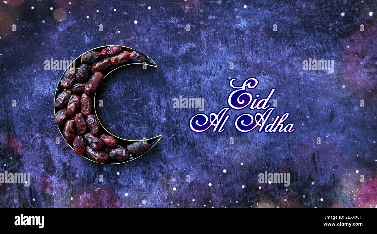 Dates in a moon shaped plate Islamic Iftar and Eid Al Adha concept background, colorful dates image decorated with  shape of crescent moon Stock Photo