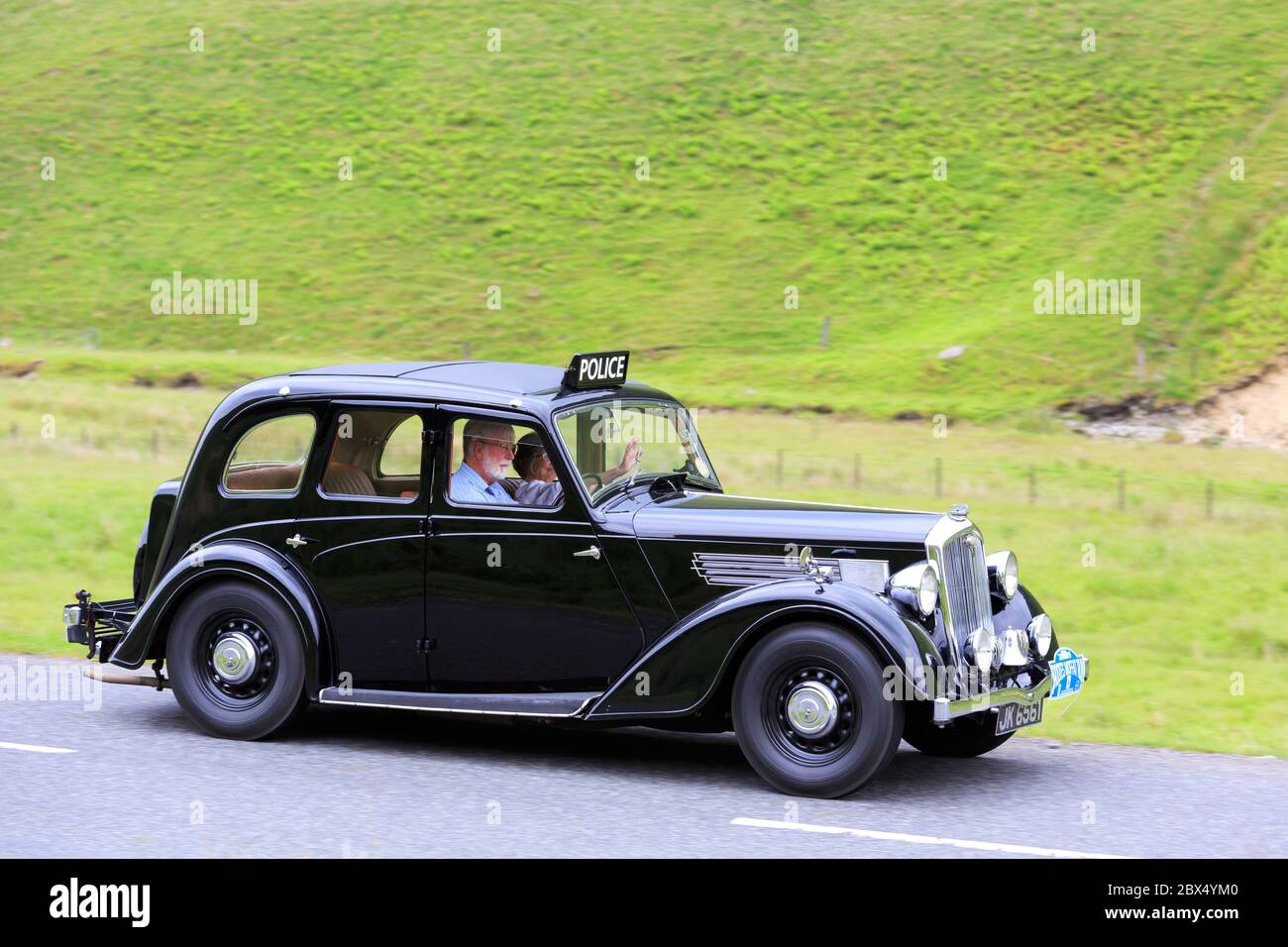 MOFFAT, SCOTLAND - JUNE 29, 2019: 1937 Wolseley Fourteen Fifty-Six police car in a classic car rally en route towards the town of Moffat, Dumfries and Stock Photo