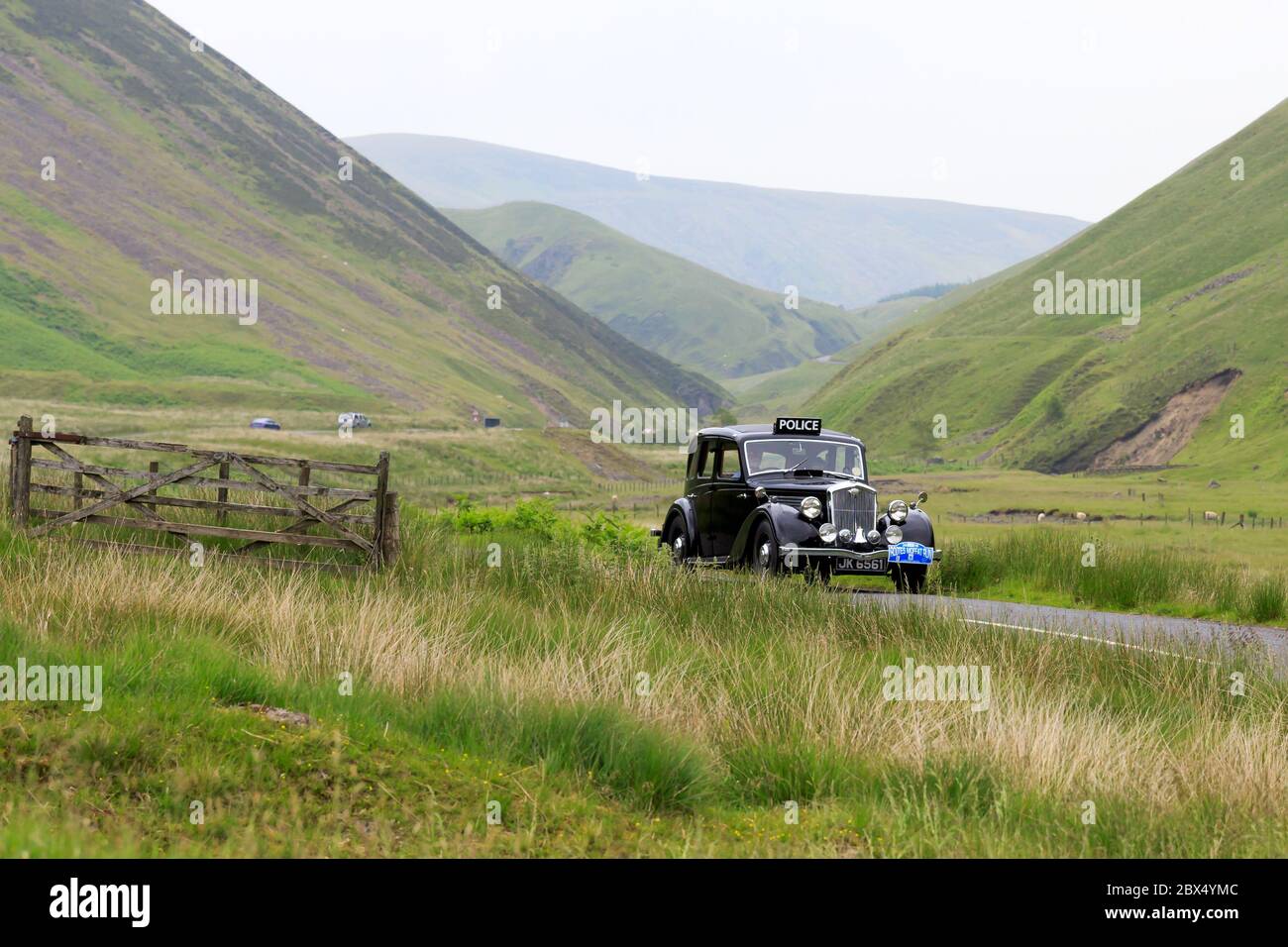 MOFFAT, SCOTLAND - JUNE 29, 2019: 1937 Wolseley Fourteen Fifty-Six police car in a classic car rally en route towards the town of Moffat, Dumfries and Stock Photo
