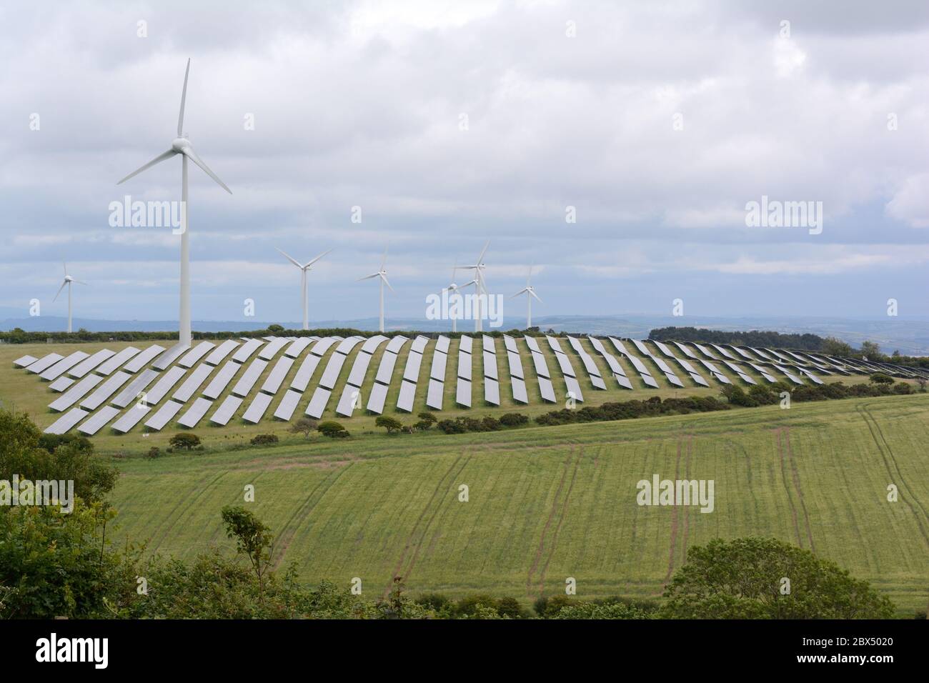 Solar panels and wind turbines in The Welsh countryside pendine Carmarthenshire Wales Cymru UK Stock Photo