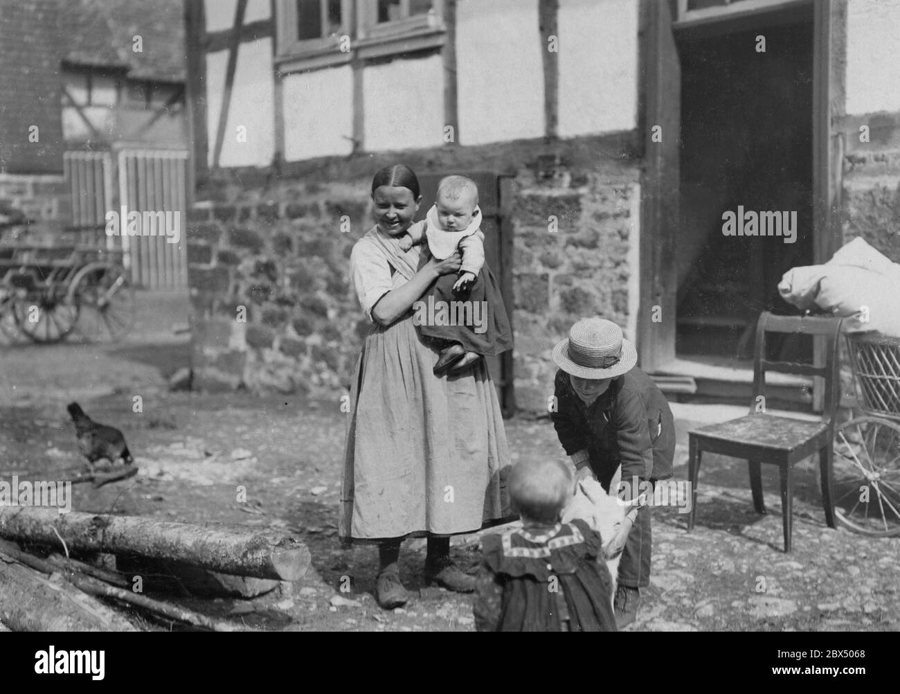 A mother with her children on a farm in Hessen. Stock Photo
