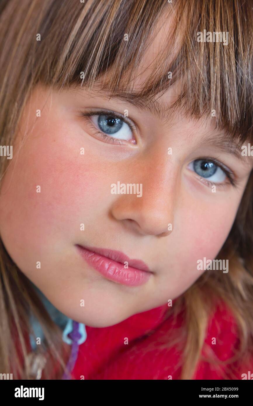 Portrait of six year old girl looking directly at camera Stock Photo