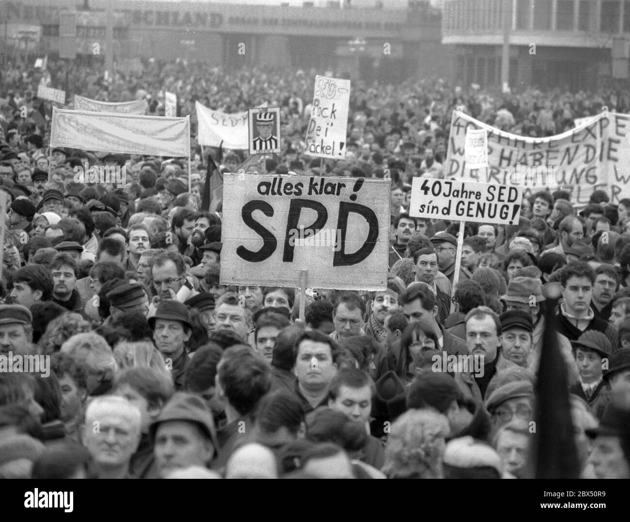 GDR / Berlin 15.1.1990 The East-SDP had just been renamed SPD. Afterwards there is a rally on the Alexanderplatz. -all clear-SPD-. 3 months later the election is lost for the SPD // Unification / Unity / History / Parties / GDR Opposition *** Local Caption *** East Germany / Communist Germany / Communist regime has gone to pieces. New Parties, till now forbidden, were re-founded. The Social Demokrats are gathering on Alexanderplatz. In March 1990 there will be an election for the East German parliament, the Volkskammer. In October the regional states will be installed. New political Stock Photo