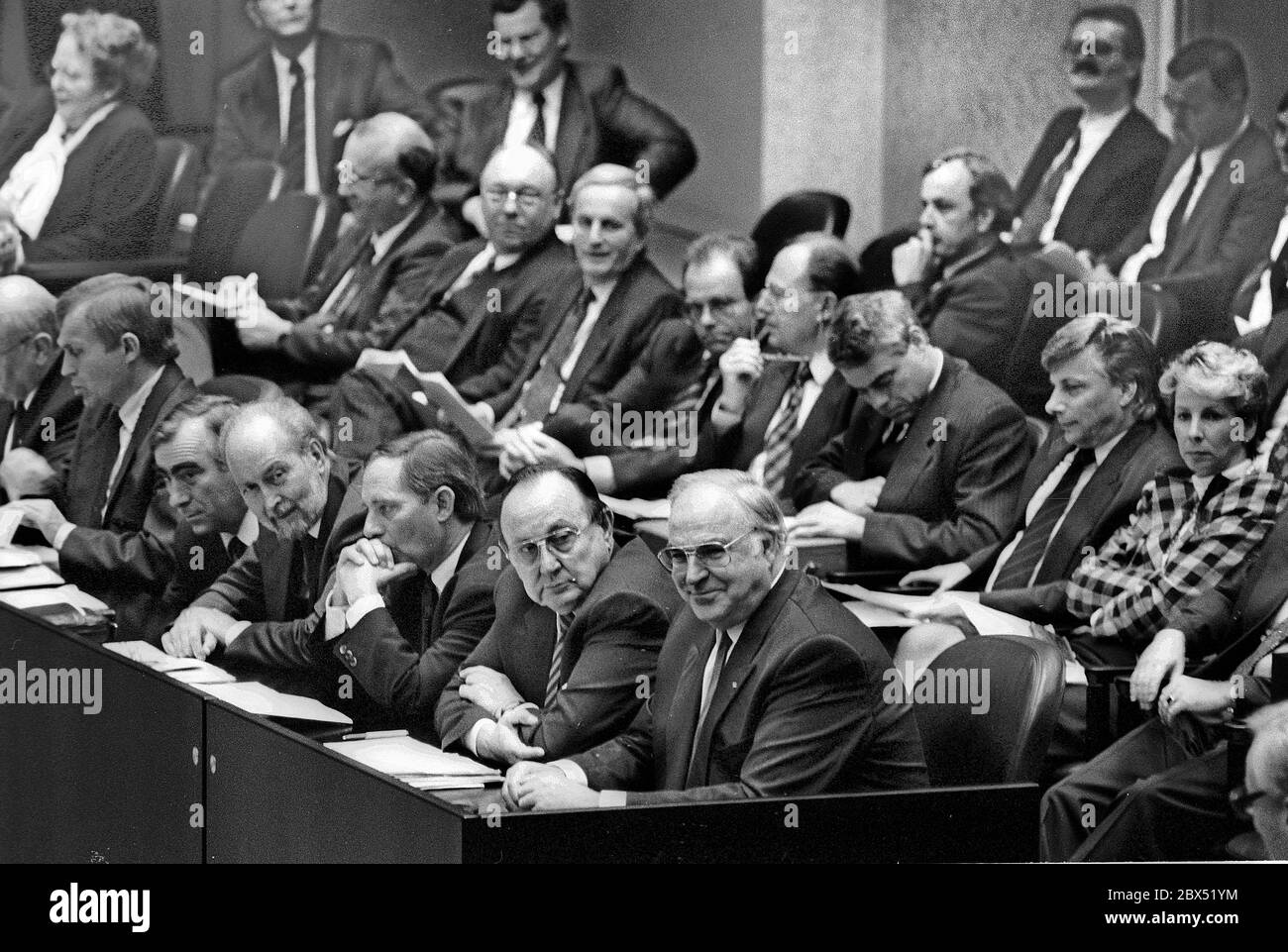 Germany / Berlin / GDR / 4.10.1990 The members of the Bundestag and the GDR People's Chamber met in the Reichstag to seal German unification. Unification formally came into force the evening before. On the government bench Helmut Kohl, Hans Dietrich Genscher, Wolfgang Schaeuble, Theo Waigel, Norbert Bluem // Unification / Agreement / CDU / D-State *** Local Caption *** East Germany / German Unification / Unity / Parliament The East German Volkskammer and West German Bundestag have a meeting in the Reichstag to pass german unity. [automated translation] Stock Photo