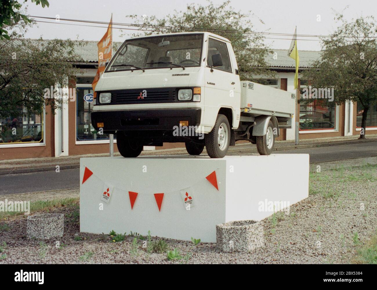 Brandenburg / Places / GDR / Region Uckermark / 1991 Signs of the turnaround: Mitsubishi truck in front of a factory in Angermuende. In GDR times a Soviet tractor stood there. (see photo1990) // Unification / Market economy / Industry / Vehicle / [automated translation] Stock Photo