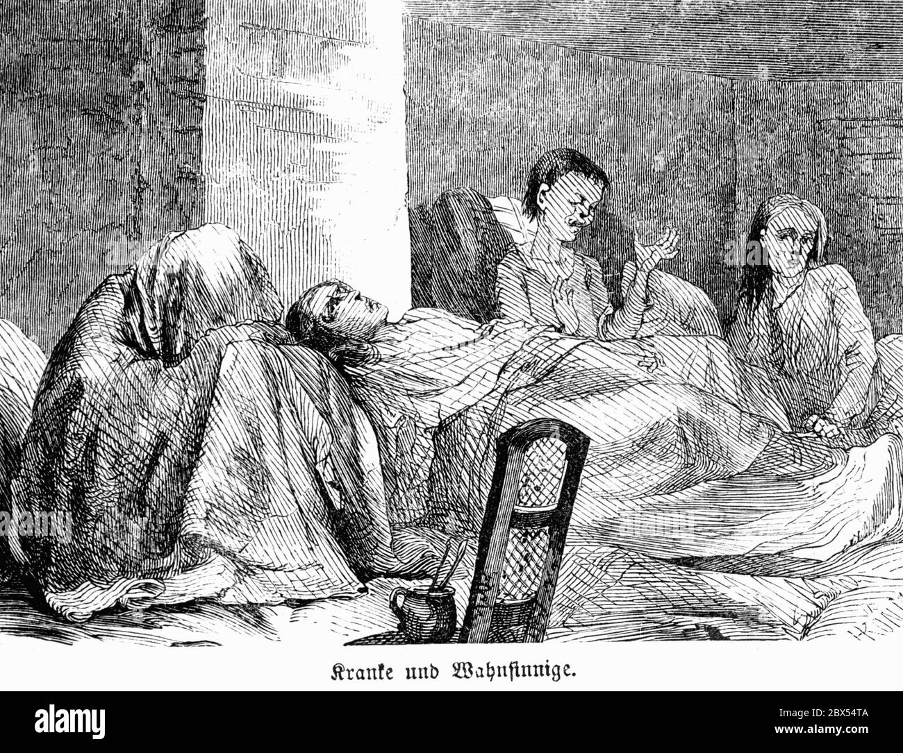 Four sick and 'insane' women lie wrapped in blankets in a windowless room of a workhouse in Berlin. Stock Photo