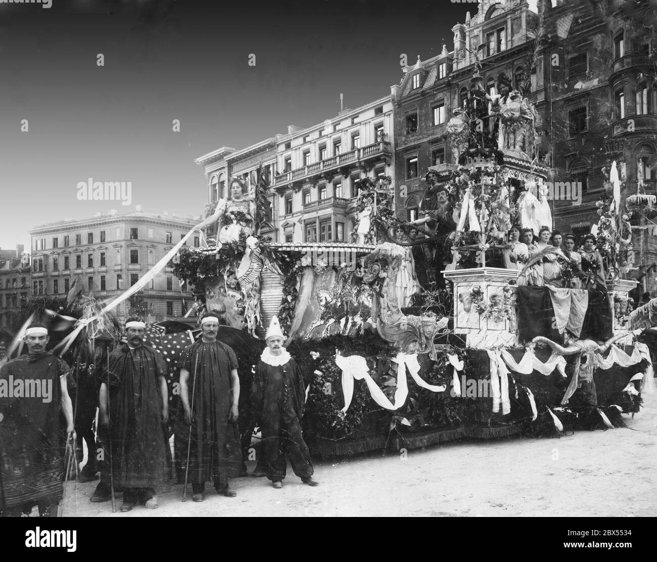 Photo of a carriage of the carnival procession from 1897, showing a parade float decorated with antique motifs depicting the 'Olympic champions of the past' with mythical and divine figures. Stock Photo