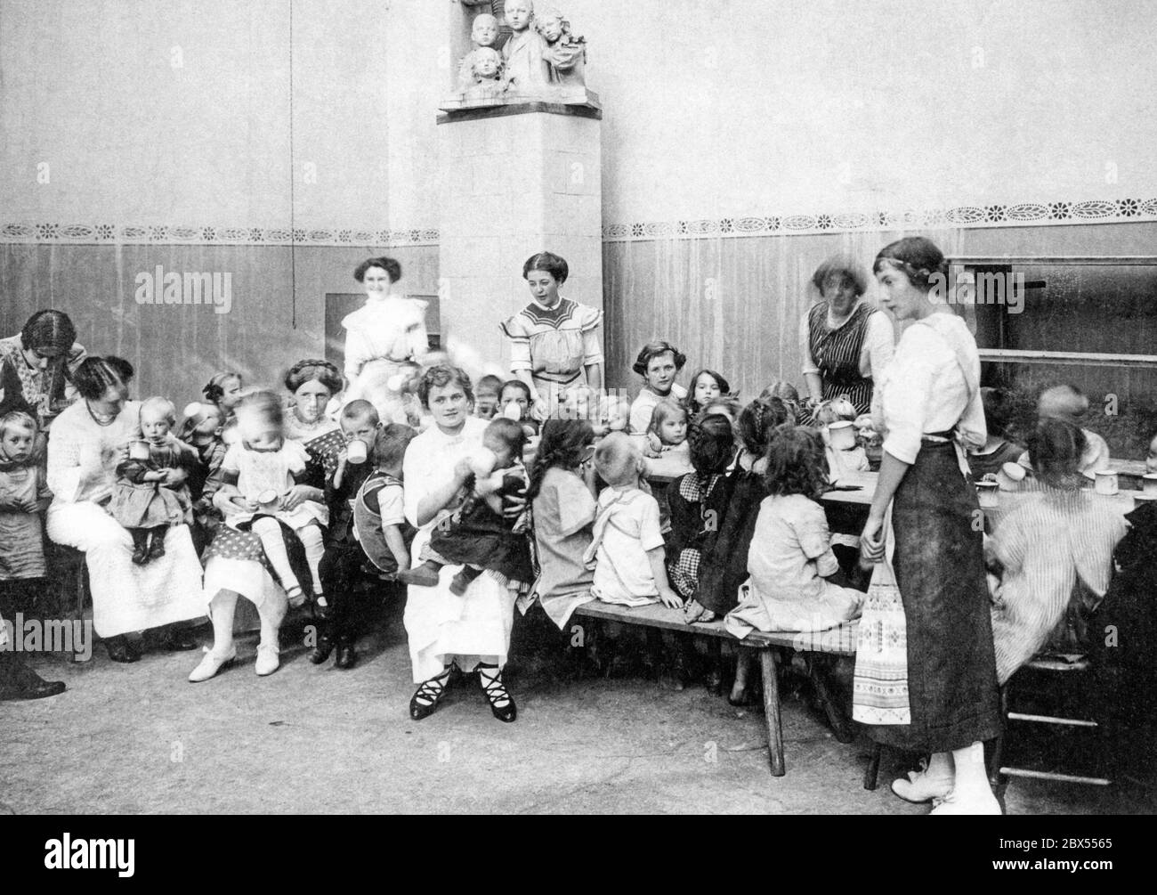 When the war broke out, many high-class women began charity work. Here are young women in a proletarian kindergarten. A few months later, when the bloody everyday life of the war began, the enthusiasm and solidarity of the upper classes evaporated. Stock Photo