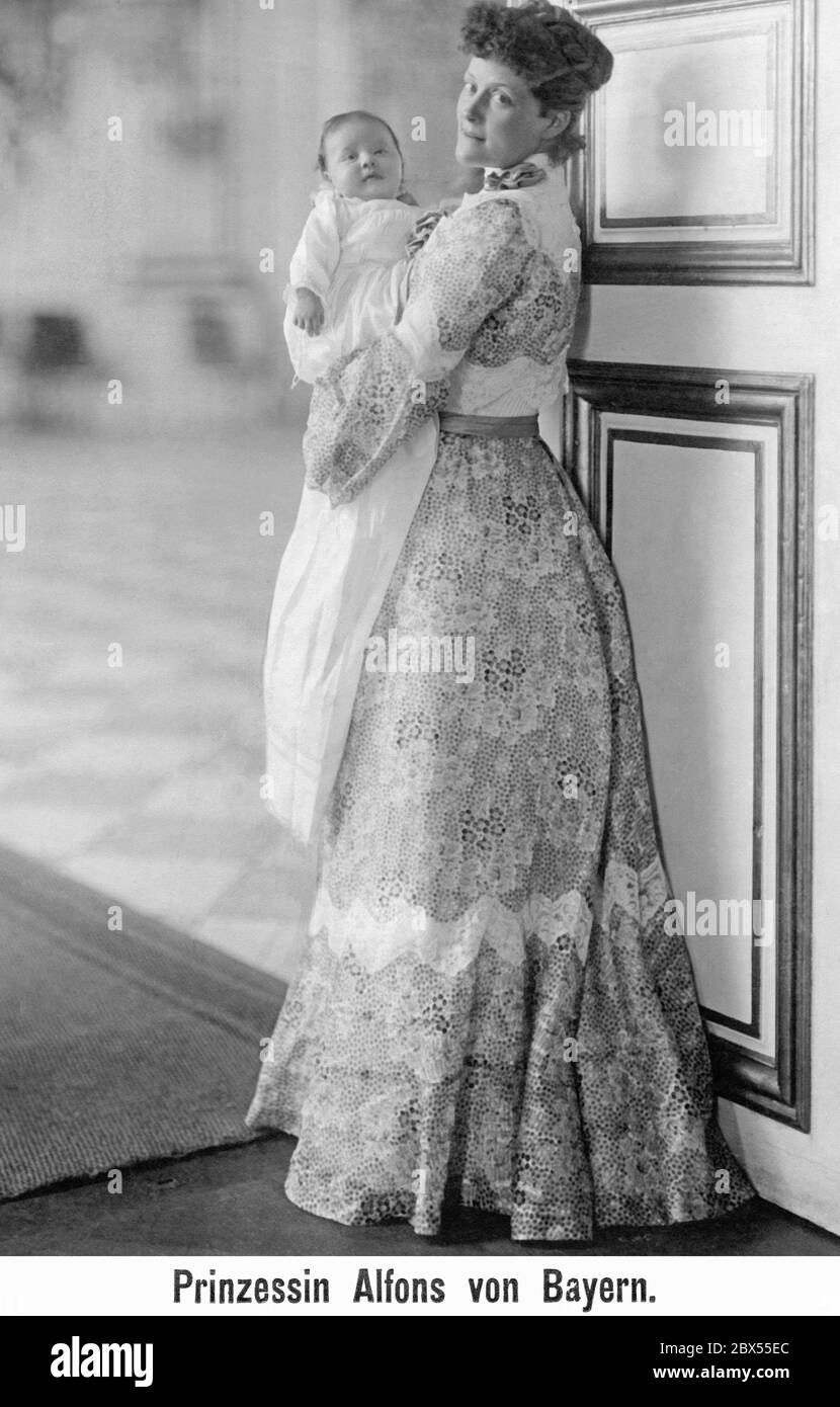 Prince Alfons of Bavaria as a baby in the arms of his mother Infanta Amalia del Pilar. Stock Photo