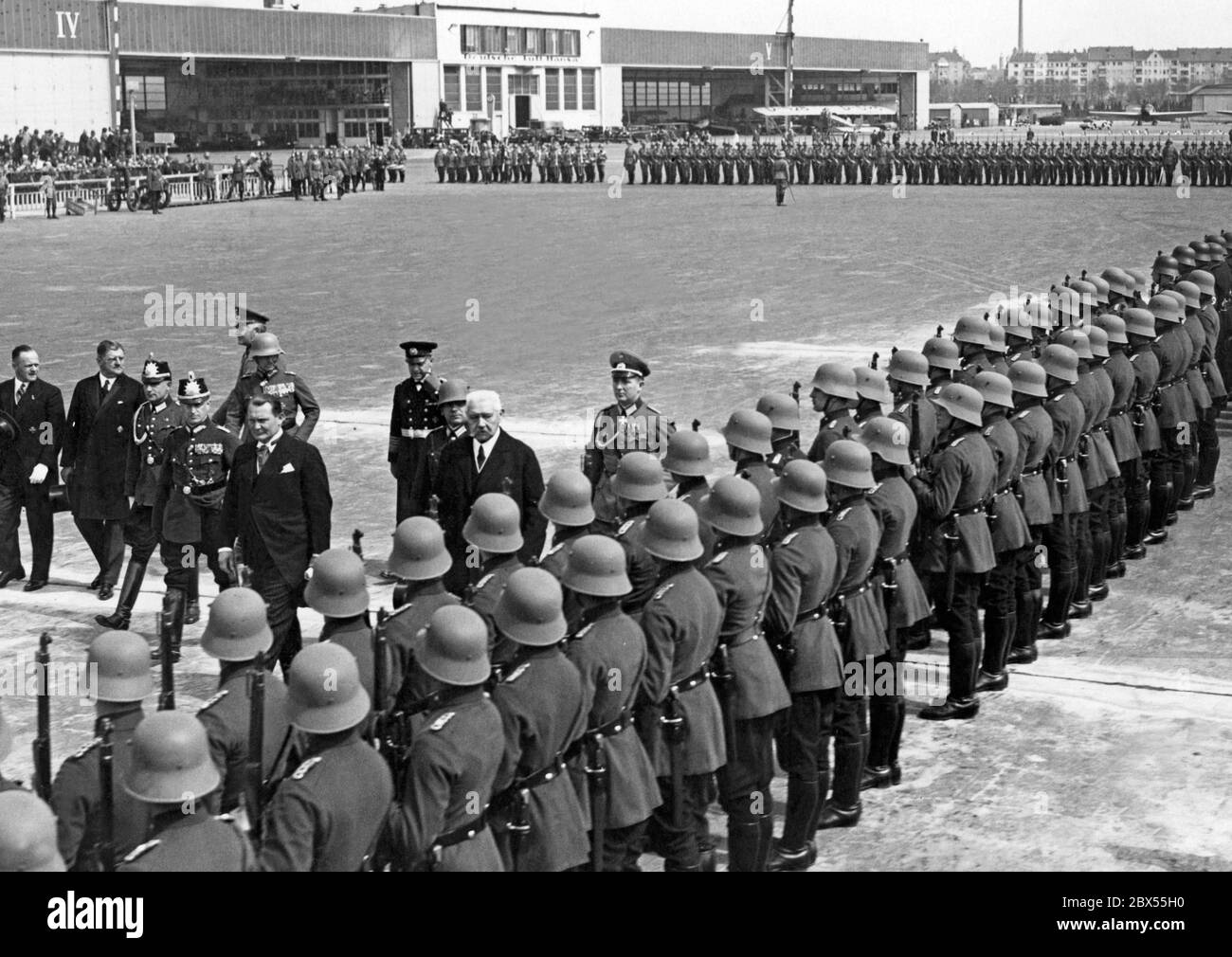 Werner von Blomberg (walking sideways behind with peaked cap), Hermann Goering and Paul von Hindenburg inspect the police formation on the occasion of the christening of a Junkers G 38 with the name Paul von Hindenburg. The then Reich Foreign Minister Konstantin von Neurath was also present at the celebrations. On the left side, 2nd from left, Erhard Milch and on the right, Otto Meissner. Stock Photo