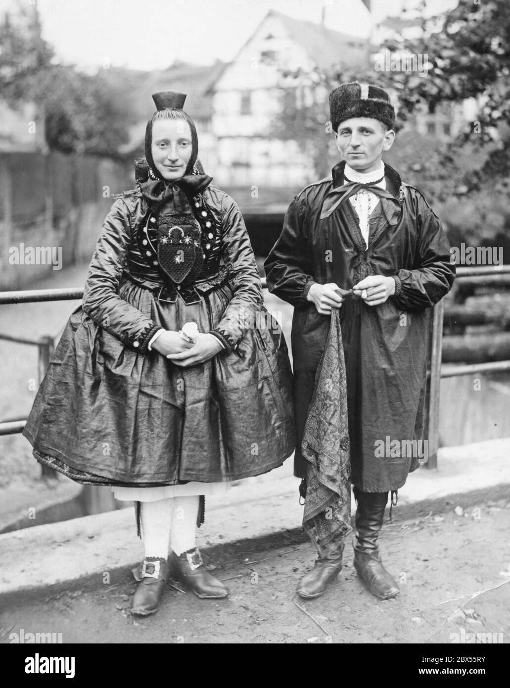 A bridal couple from Baden in their fine traditional folk costumes ...