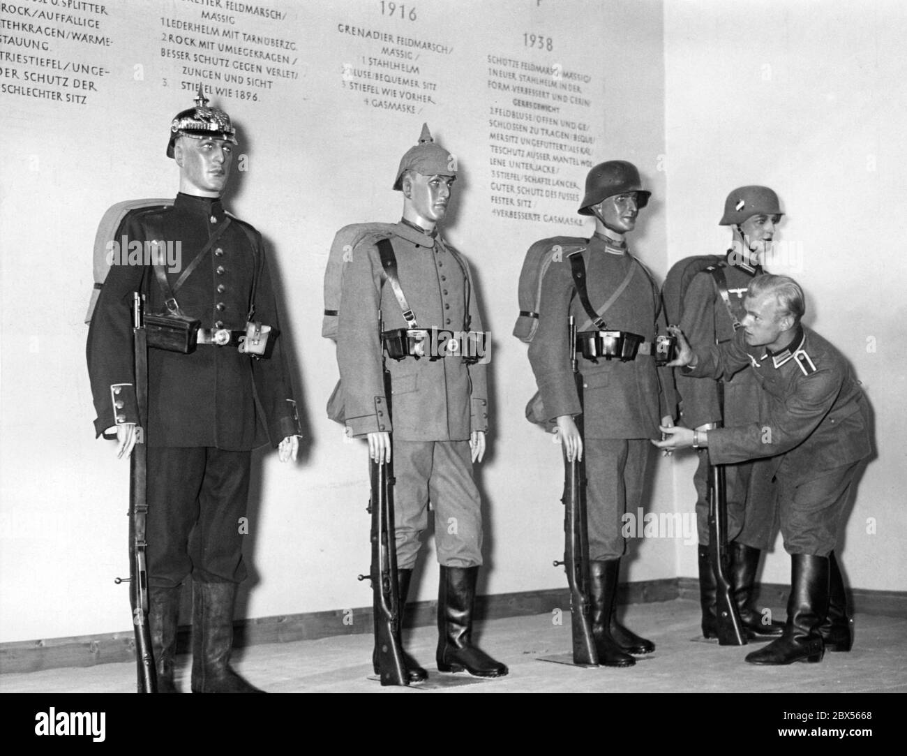 Setting up the exhibition 'Gesundes Leben - Frohes Schaffen' ( Healthy Life - Glad Work) at Kaiserdamm in Berlin.  In the Wehrmacht section are displayed various uniforms showing the hygienic development. Stock Photo