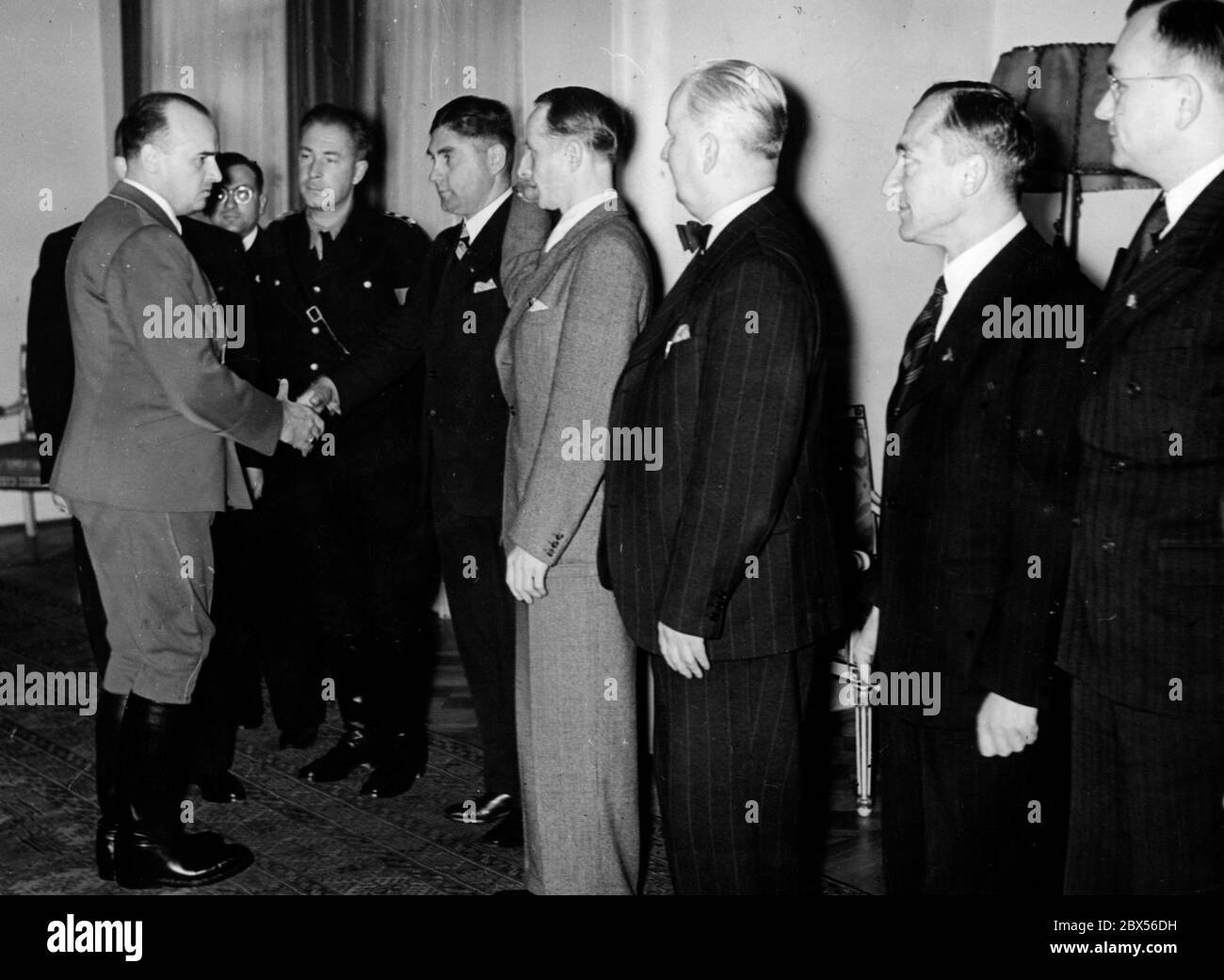 Reich Minister and Governor General of occupied Poland Hans Frank greets the press representatives on the Victory Day anniversary in Warsaw. Stock Photo