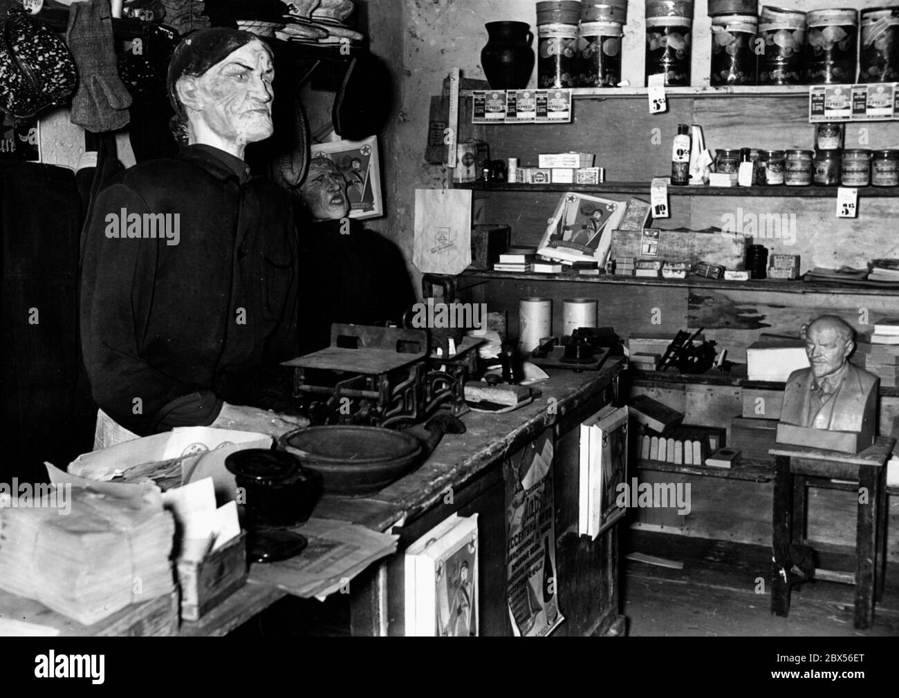 View of the exhibition 'The Soviet Paradise' in the Berlin Lustgarten: Representation of a shop owner in a simple shop. Stock Photo