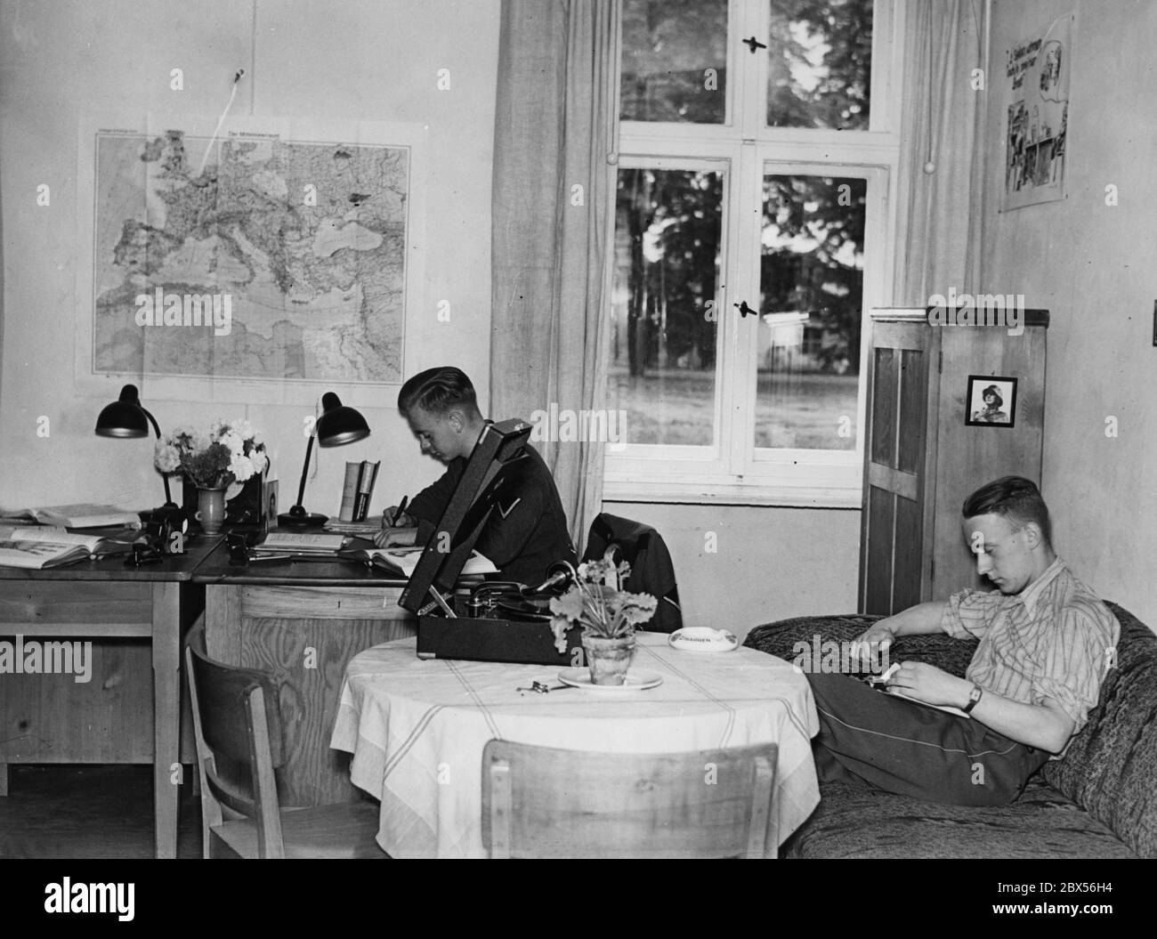 Fahnenjunker in their rooms (single and double rooms) at the Military Medical Academy in Berlin. On the wall there is a map of Europe. Stock Photo