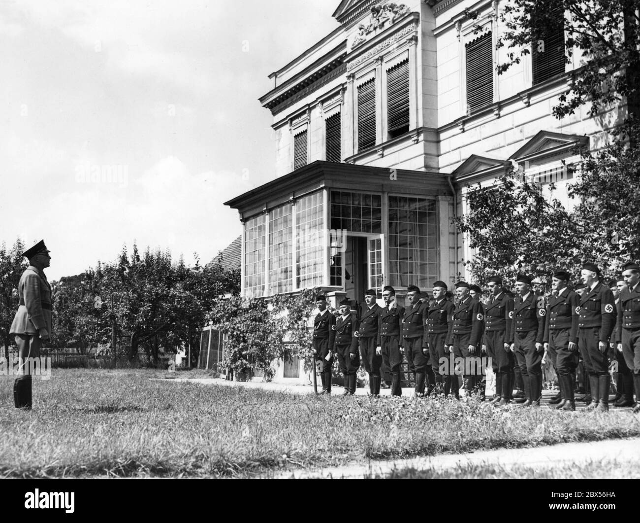 The Berlin City School Councilor Hans Meinshausen, Gauwalter of the National Socialist Teachers League (Nationalsozialistischer Lehrerbund), gives a speech to the teachers at the opening of the  third NSLB Reich Exchange Camp at Tasdorf Manor (right) near Ruedersdorf. Stock Photo