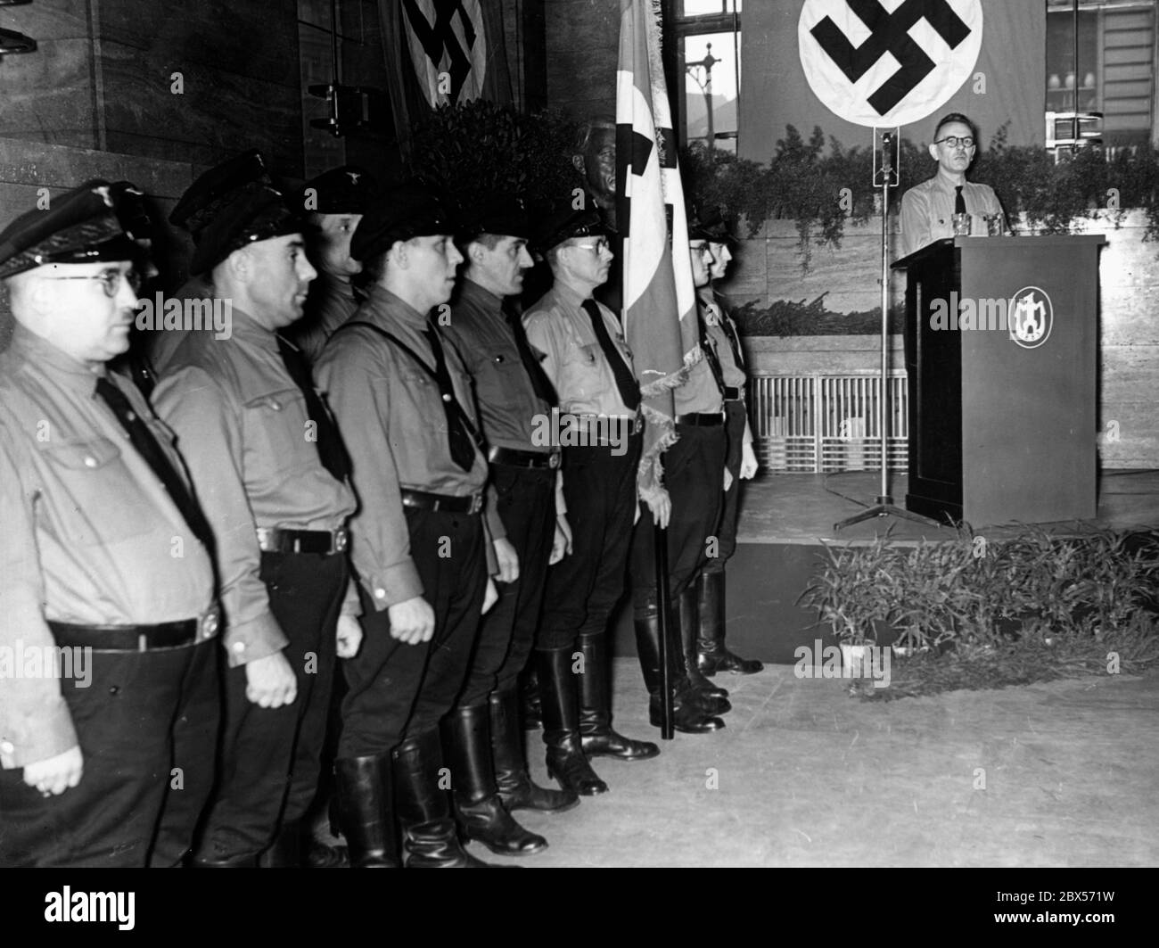 A Betriebsobmann of the NSDAP gives a speech to the workforce in a large Berlin company. Stock Photo