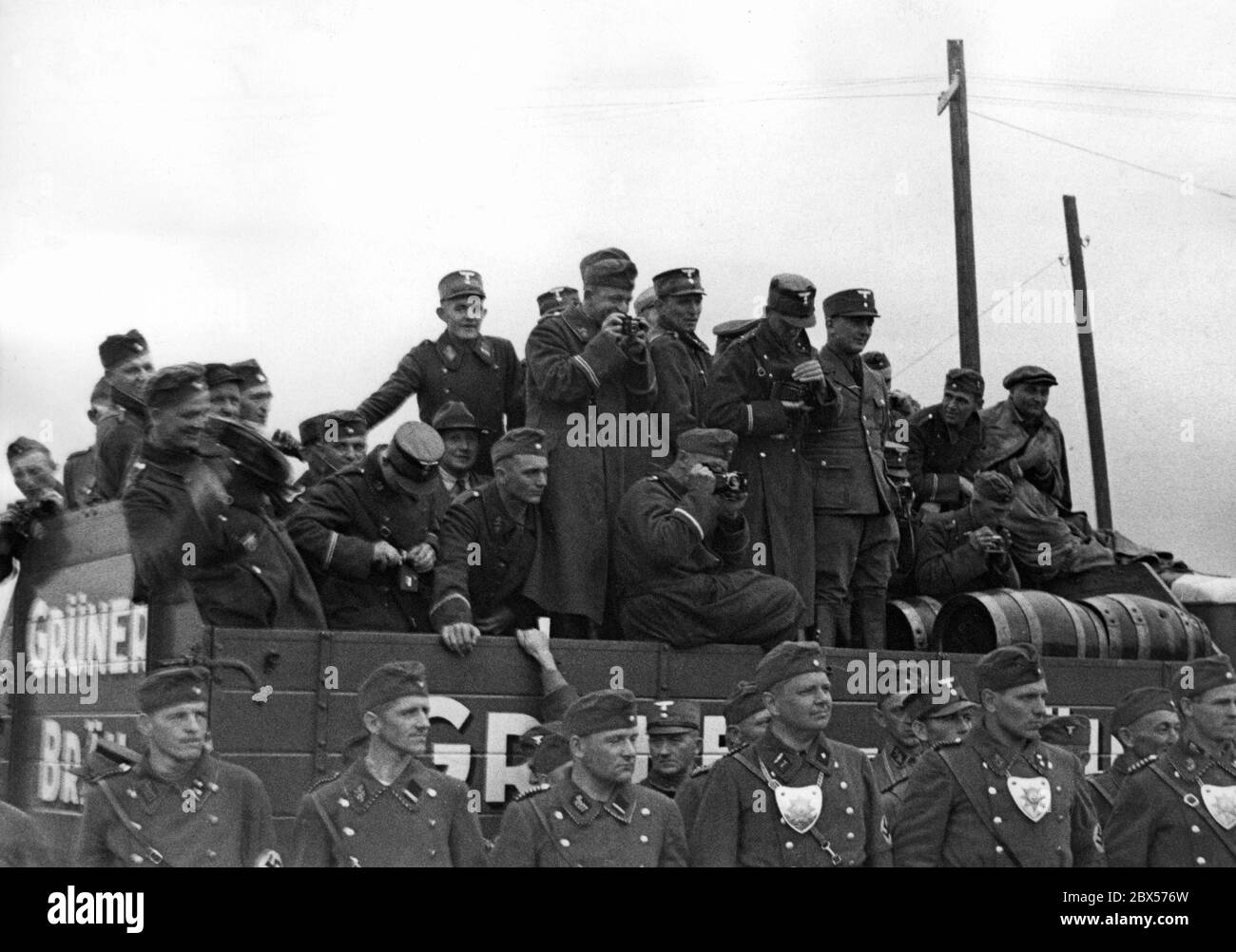During Joseph Goebbels' visit to the Langwasser camp, where the SA of Greater Berlin is stationed, SA men are standing on a truck of 'Gruener Braeu' to pose for a good souvenir photo. Stock Photo