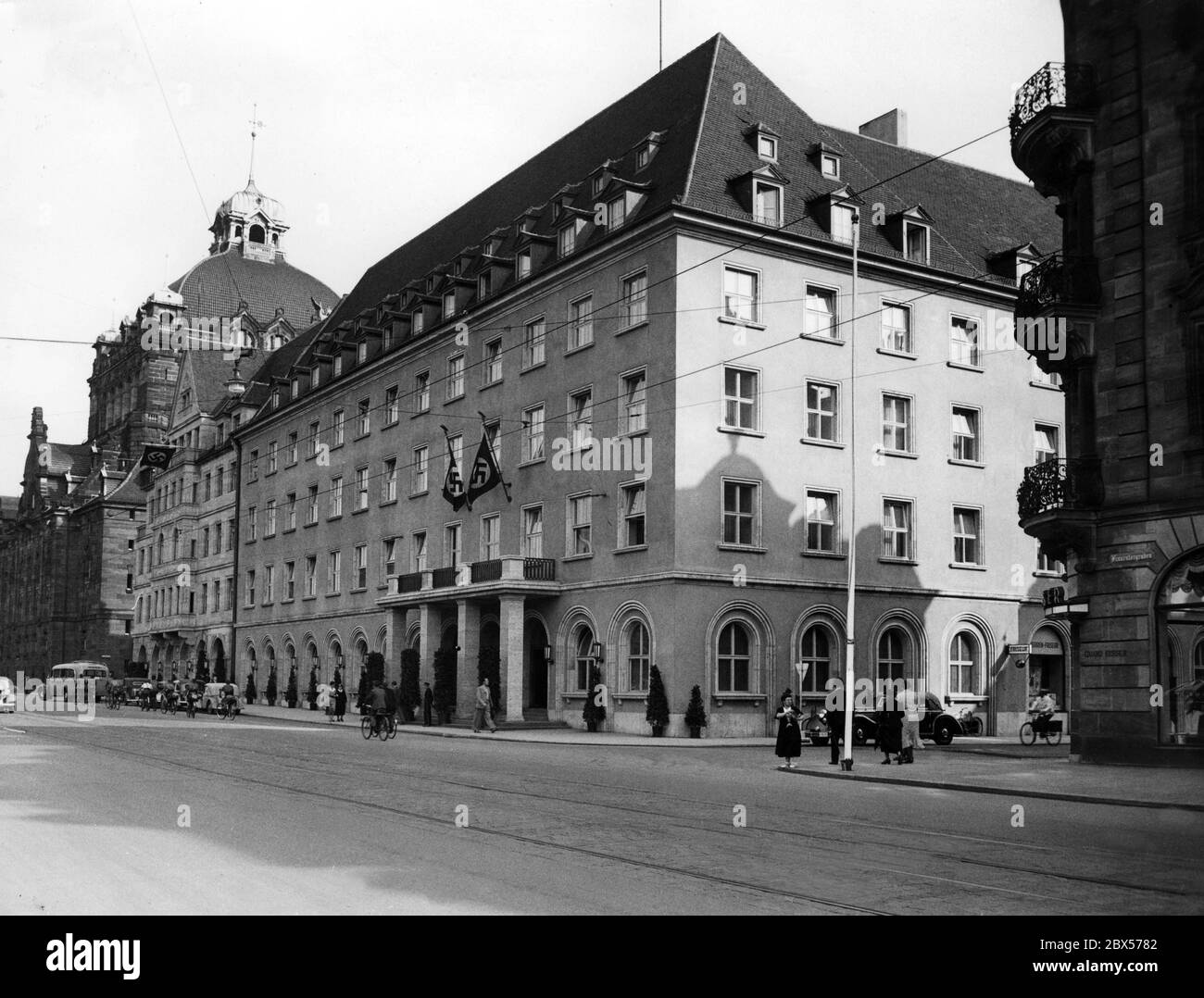 Final preparations for the Reichsparteitag der Arbeit (Reich Party Conference of Labour) also take place in the Hotel Deutscher Hof, Hitler's annual accommodation. To the left of it, at the Frauentorgraben is the Nuremberg State Theatre. Stock Photo