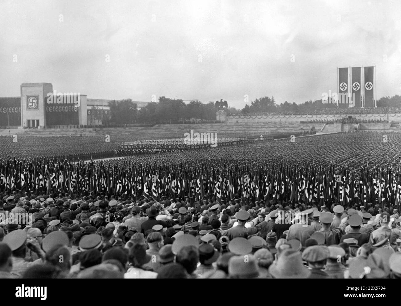 Overview of the parade of SA, SS, NSKK and NSFK in the Luitpold Arena on the Nazi Party Rally Grounds in Nuremberg. In the background at left is the Luitpoldalle, at right the platform. Stock Photo