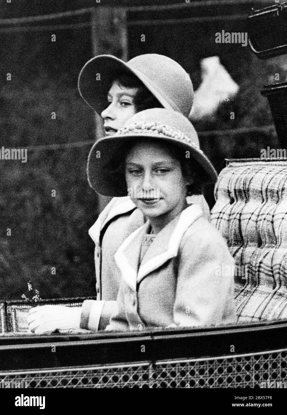 Princess Margaret in a carriage with her sister Princess Elizabeth on her 9th birthday. Stock Photo