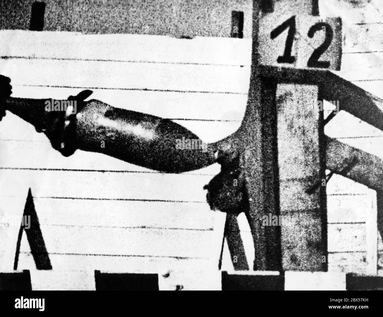 A slow-motion camera is to provide information on the production of bombs and ammunition. This slow-motion image shows the impact of armor-piercing ammunition on the steel test target. It can already be seen how the bullet deforms the metal surface. Depending on the type of ammunition, the target will be penetrated in different ways. Stock Photo