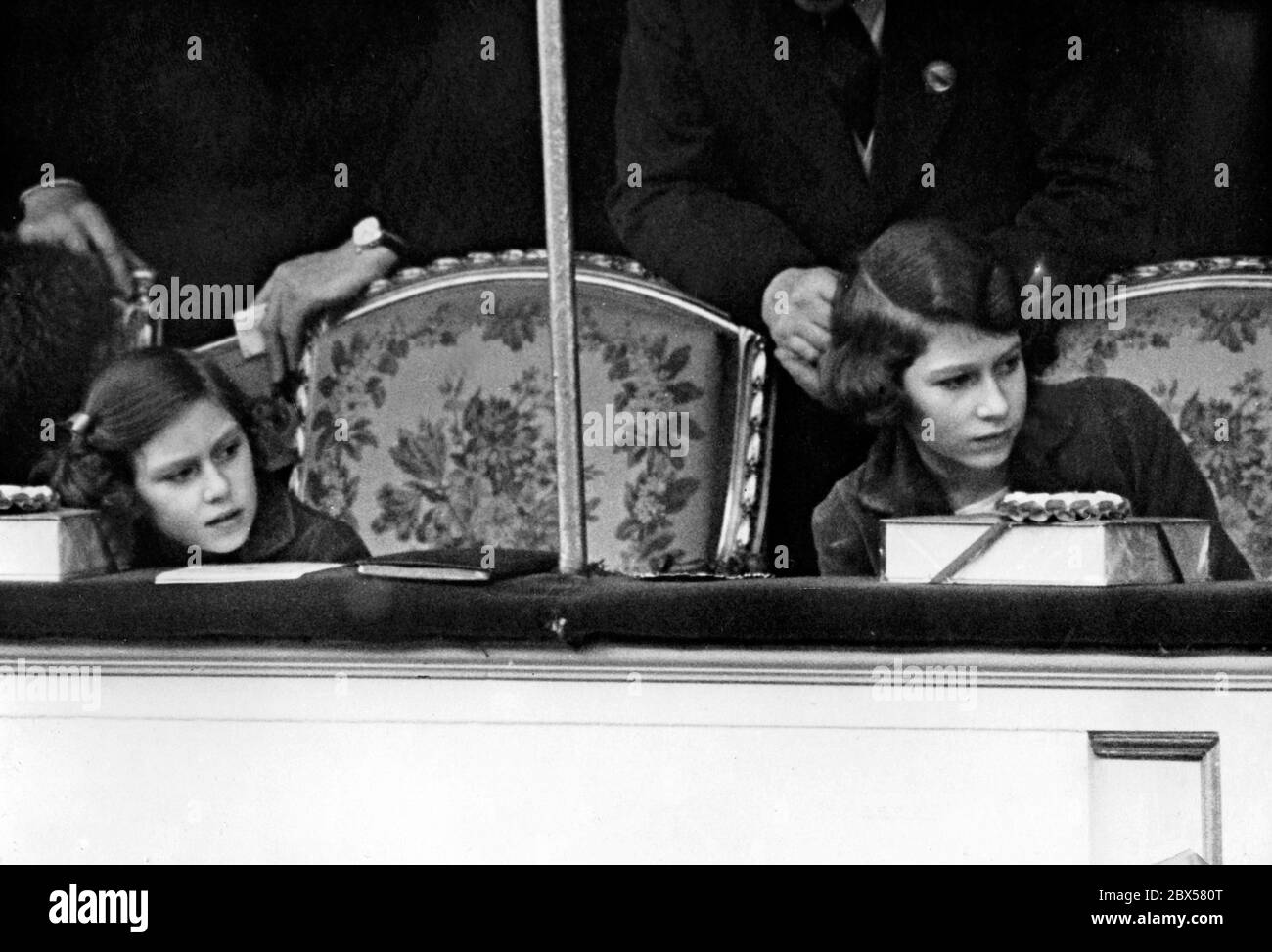 Elizabeth II and her sister Princess Margaret Rose (left) are attending the National Pony Show at the Royal Agriculture Hall in Islington, London. Stock Photo