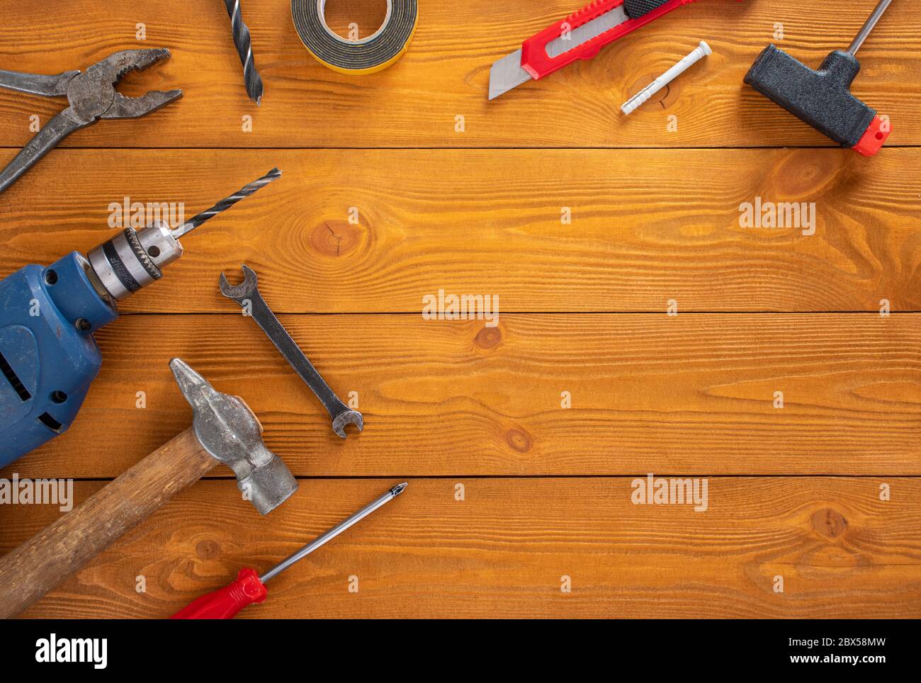 Top view layout of tools for repair on wooden background, free space for text Stock Photo