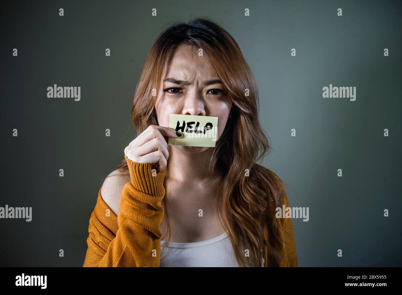 dramatic portrait of young sad and depressed Asian Korean student ...
