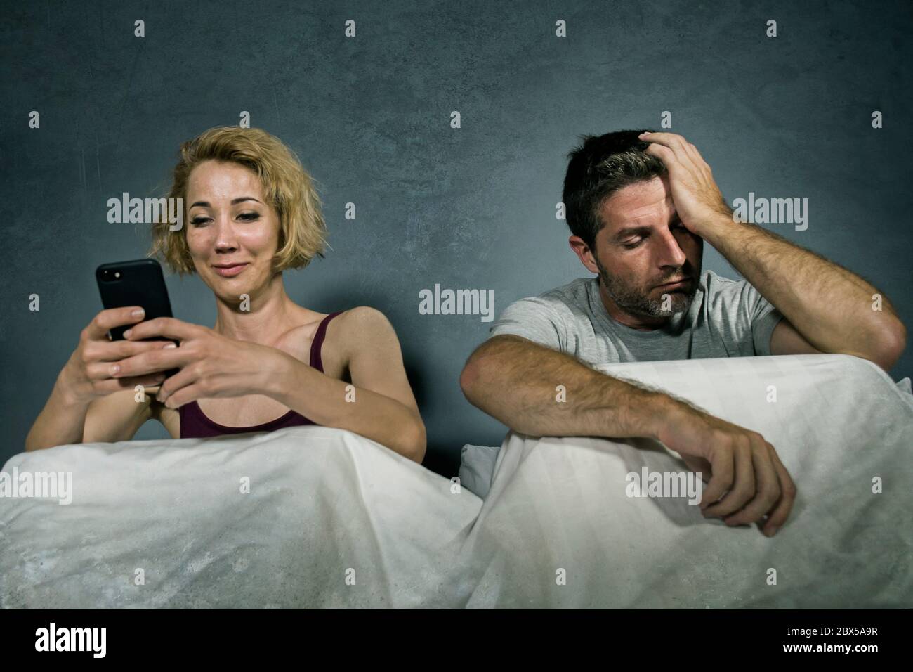 Picture of Wife feeling neglected by husband hi-res stock photography and images ...