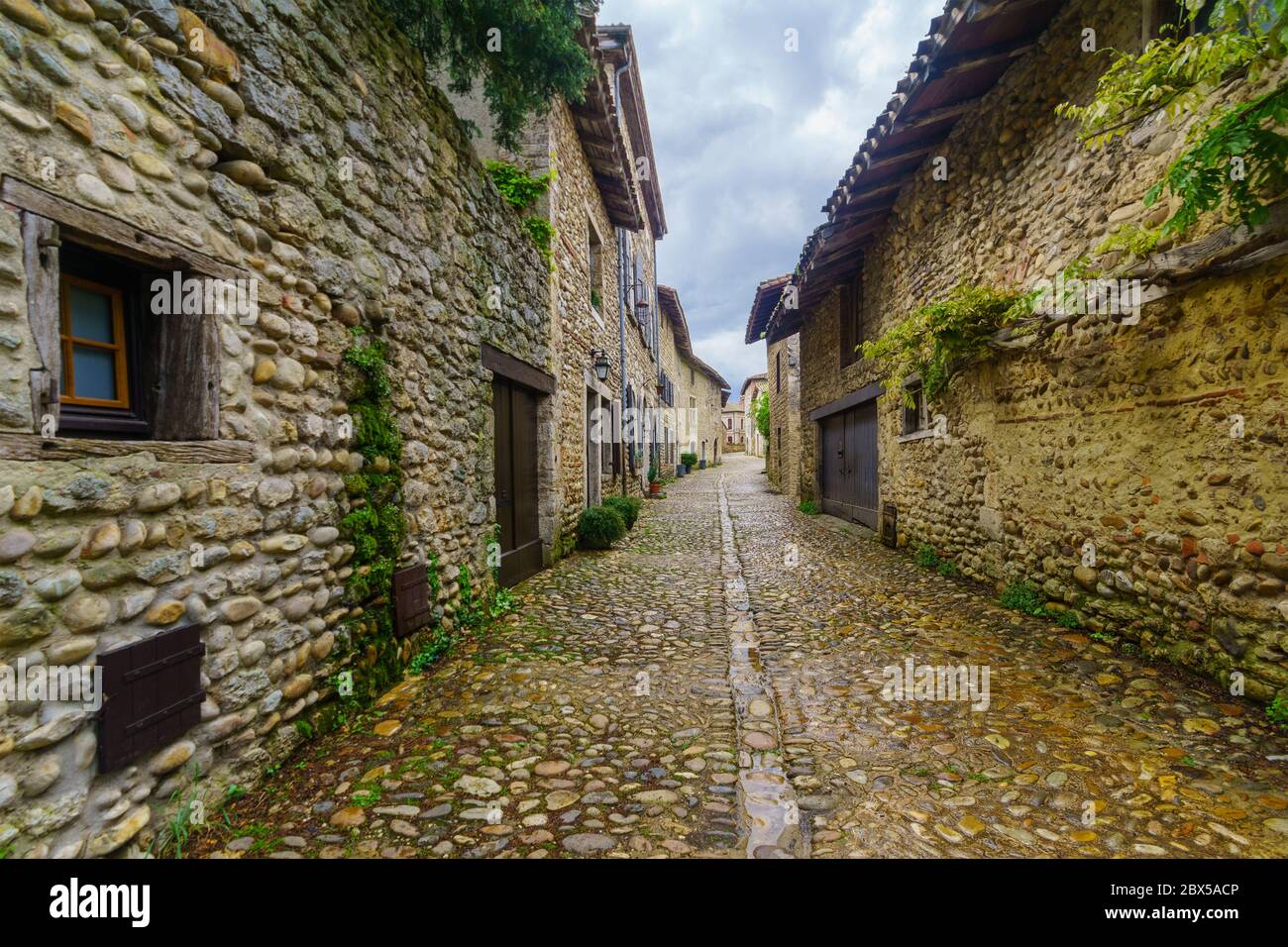 View of an alley in the medieval village Perouges, Ain department ...