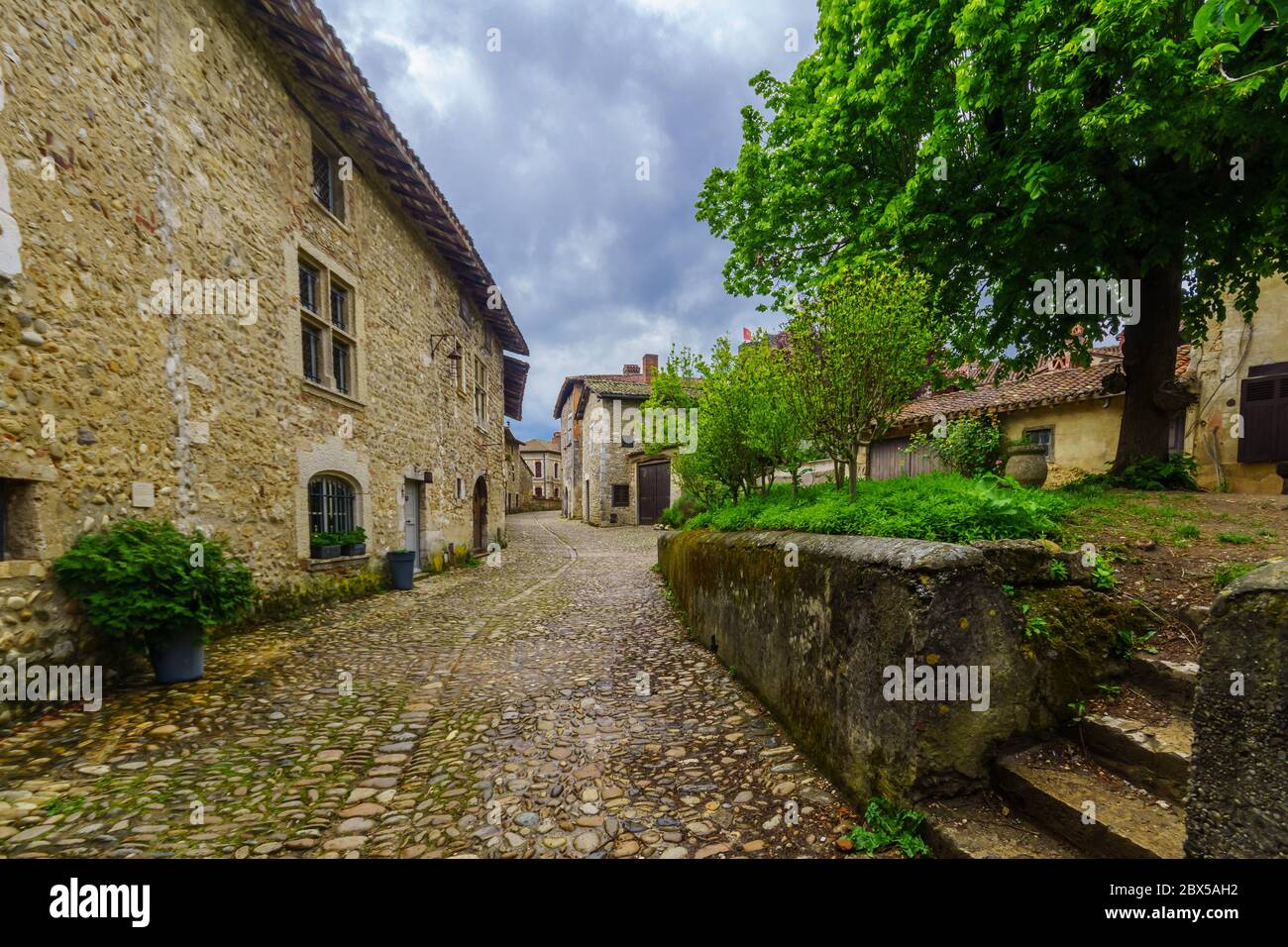 View of an alley in the medieval village Perouges, Ain department ...