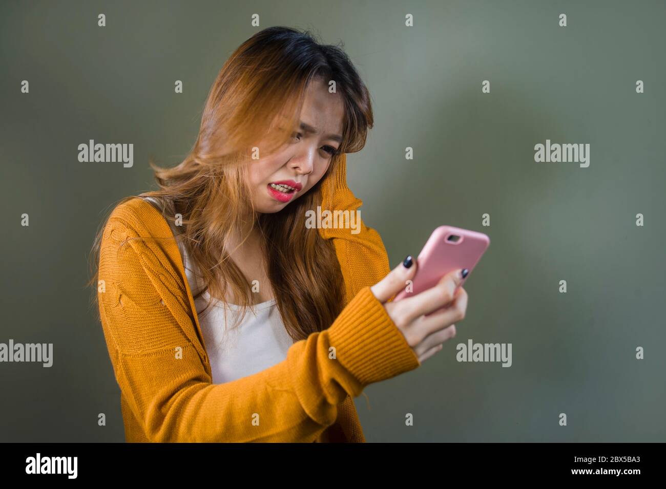 Young Cute And Sad Asian Korean Girl Feeling Broken Heart And Desperate Holding Mobile Phone Suffering Relationship Break Up Dumped Via Internet Messa Stock Photo Alamy