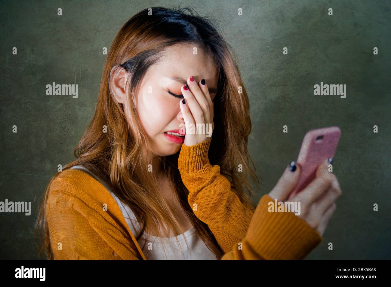 young cute and sad Asian Korean girl feeling broken heart and desperate ...